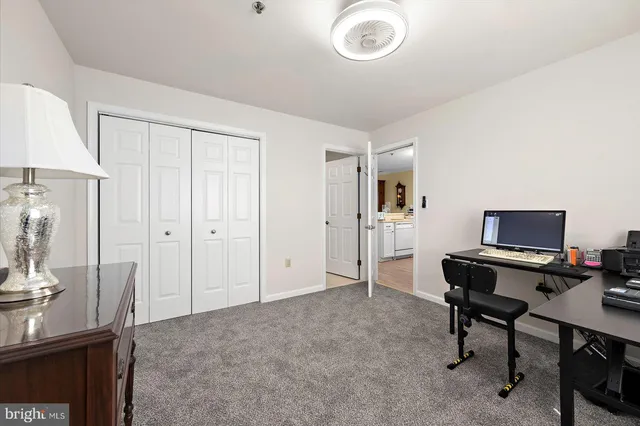 a view of a workspace with furniture