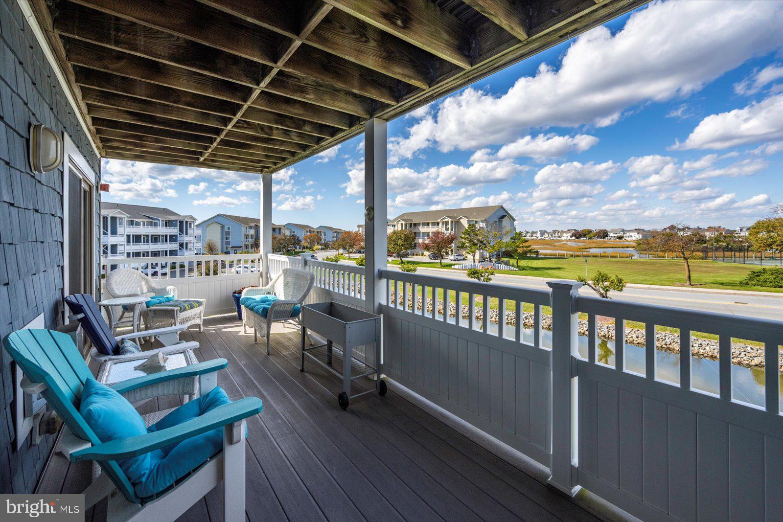 201 South Heron Drive, Unit 2D Ocean City, MD 21842 - Photo 26 of 61 a view of a chairs and table in the balcony