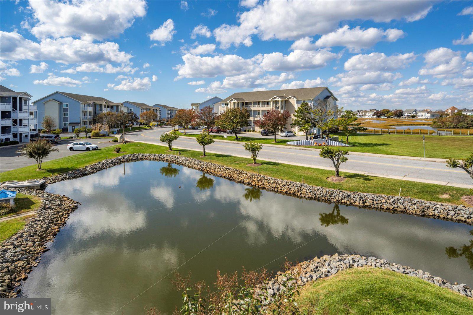 201 South Heron Drive, Unit 2D Ocean City, MD 21842 - Photo 32 of 61 Peaceful community pond right out front