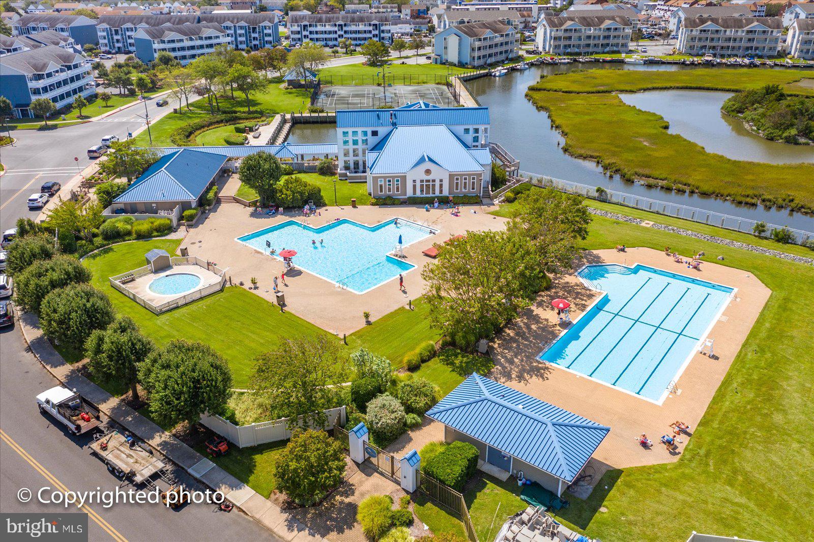 201 South Heron Drive, Unit 2D Ocean City, MD 21842 - Photo 39 of 61 an aerial view of a pool patio swimming pool and outdoor seating