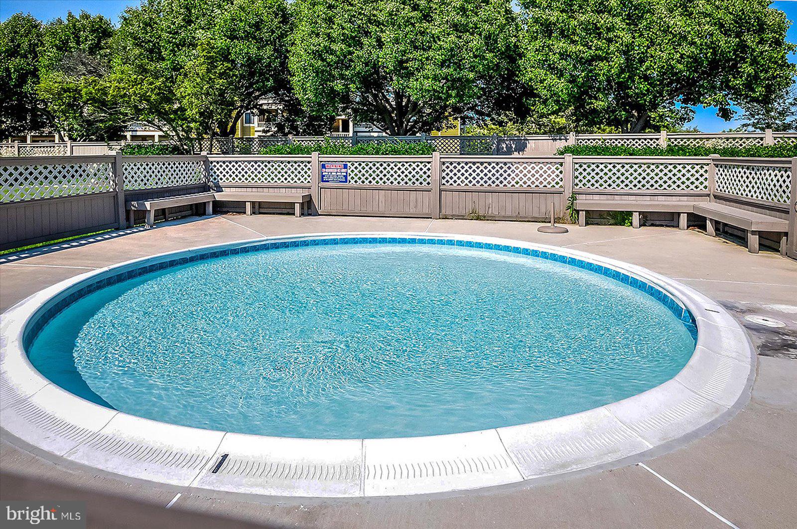 201 South Heron Drive, Unit 2D Ocean City, MD 21842 - Photo 56 of 61 a view of a swimming pool with a outdoor seating