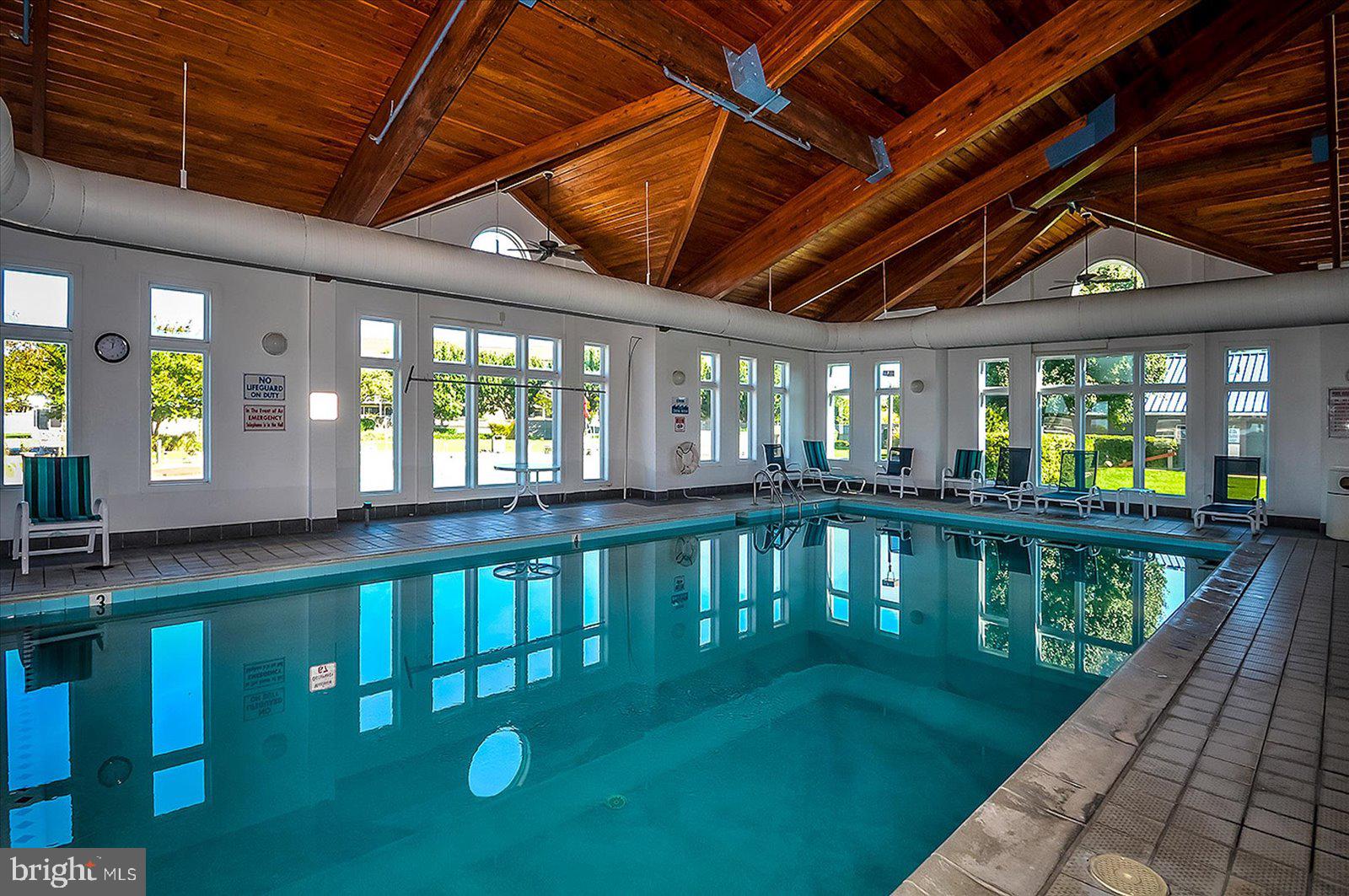 201 South Heron Drive, Unit 2D Ocean City, MD 21842 - Photo 57 of 61 a view of swimming pool with outdoor seating