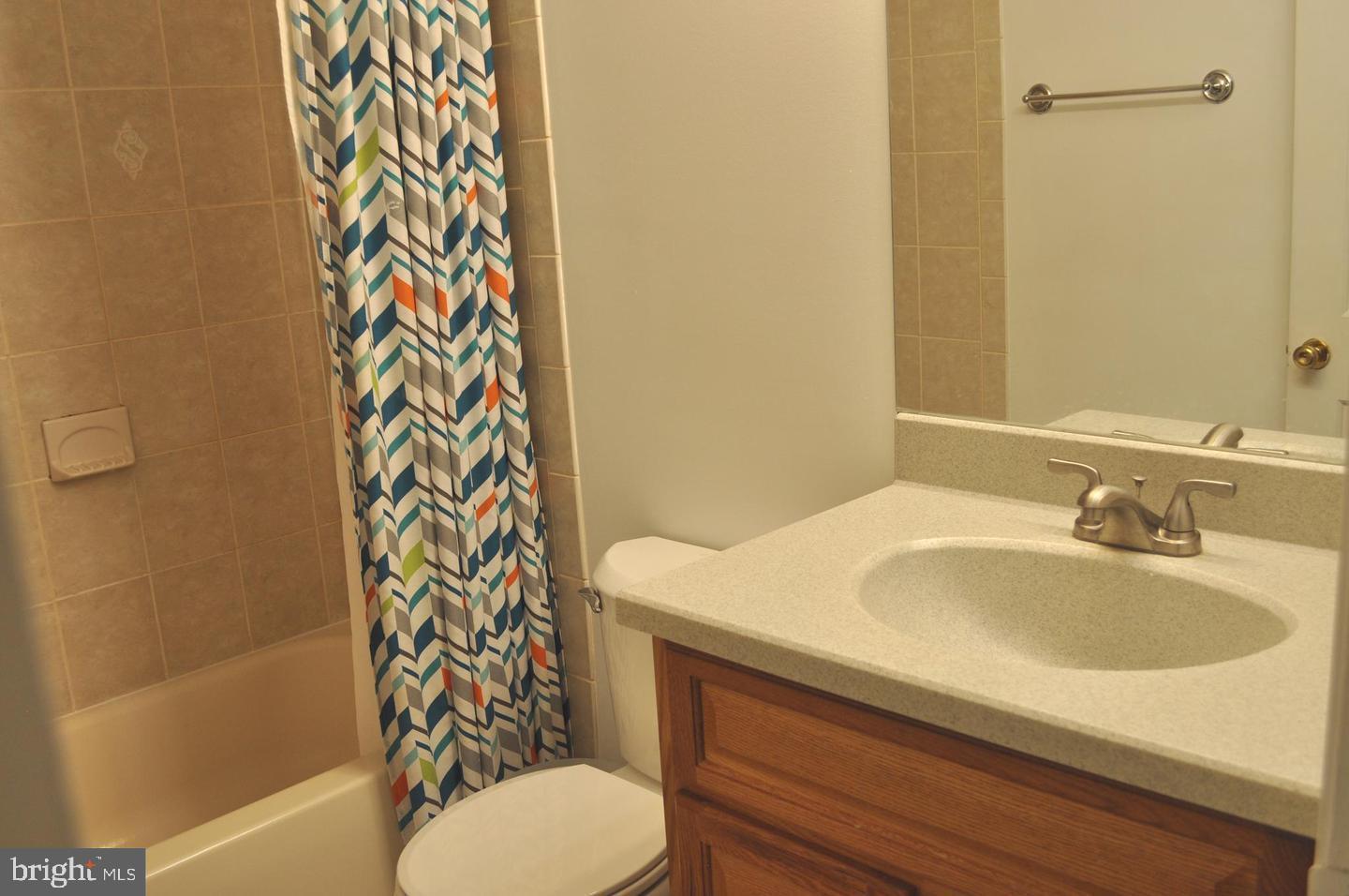 14613 Tynewick Terrace, Unit 61461 Silver Spring, MD 20906 - Photo 11 of 30 a bathroom with a sink and toilet
