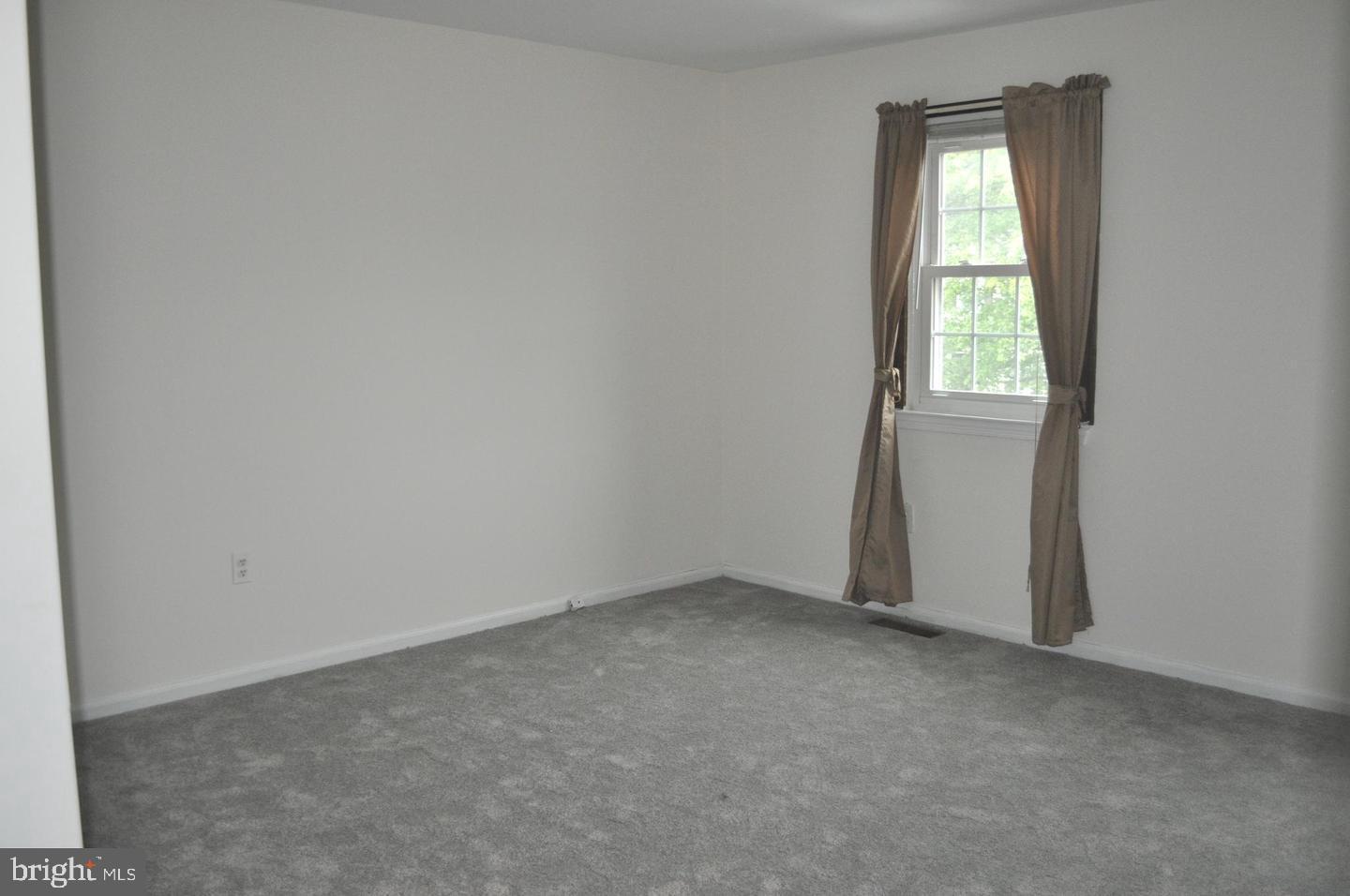 14613 Tynewick Terrace, Unit 61461 Silver Spring, MD 20906 - Photo 13 of 30 an empty room with a window