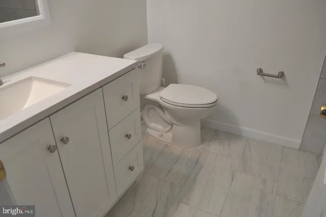 a view of an empty room and a window