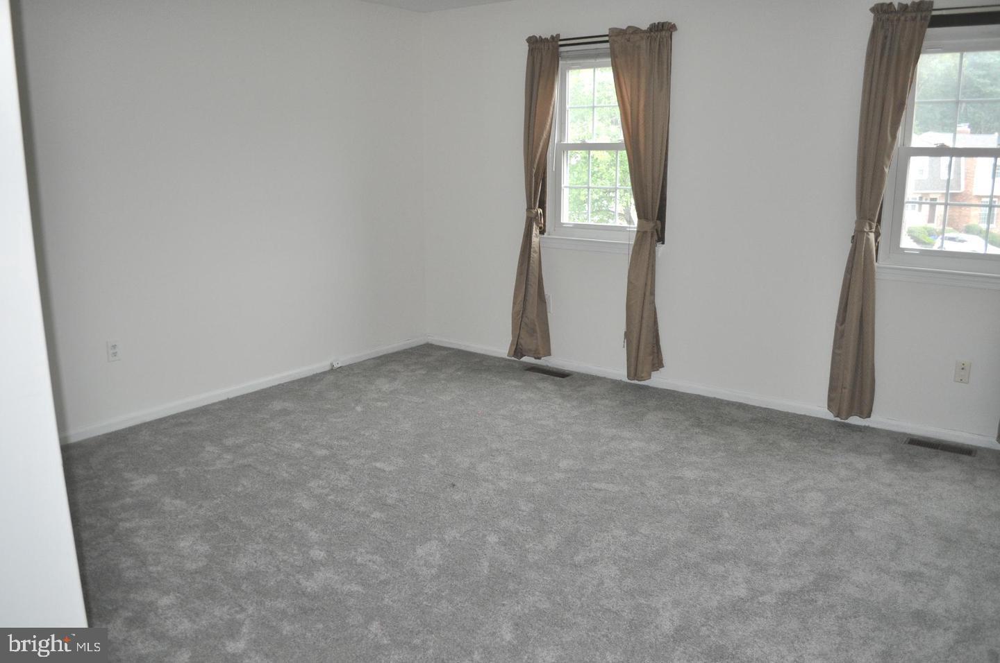 14613 Tynewick Terrace, Unit 61461 Silver Spring, MD 20906 - Photo 16 of 30 an empty room with windows