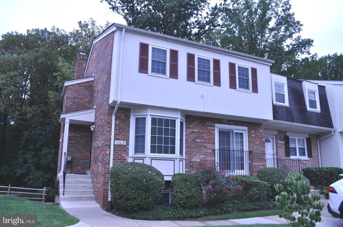 14613 Tynewick Terrace, Unit 61461 Silver Spring, MD 20906 - Photo 2 of 30 a front view of a house with garden