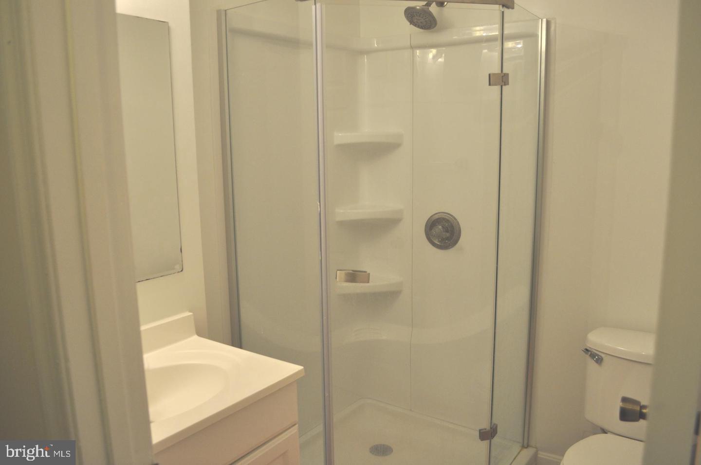 14613 Tynewick Terrace, Unit 61461 Silver Spring, MD 20906 - Photo 21 of 30 a bathroom with a shower and toilet