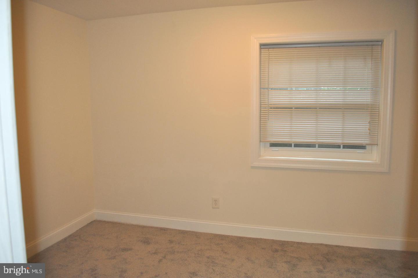 14613 Tynewick Terrace, Unit 61461 Silver Spring, MD 20906 - Photo 22 of 30 an empty room with a window