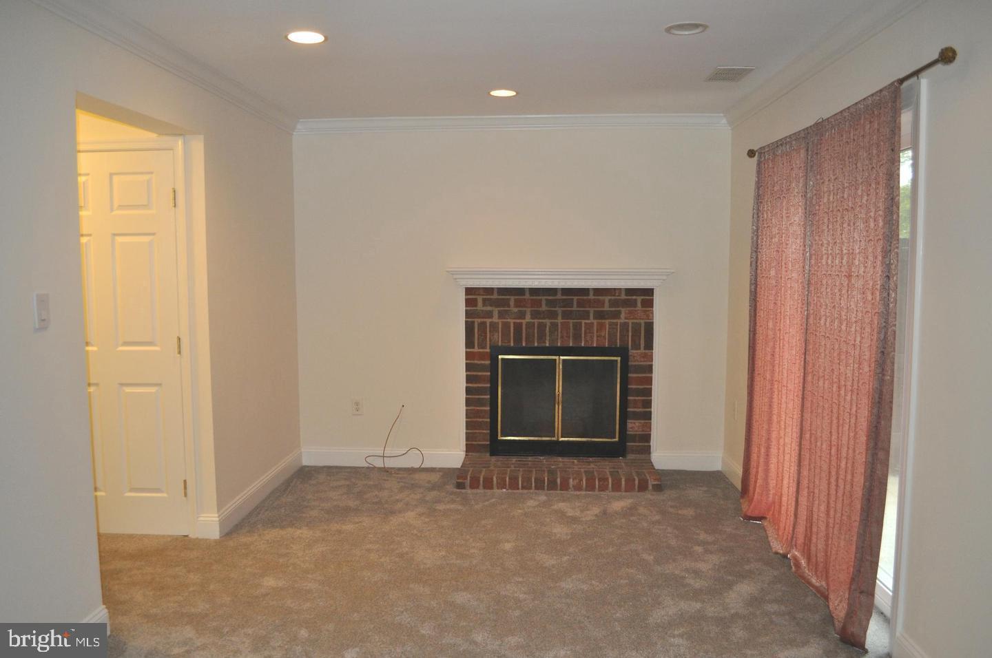 14613 Tynewick Terrace, Unit 61461 Silver Spring, MD 20906 - Photo 24 of 30 a view of empty room with a fireplace