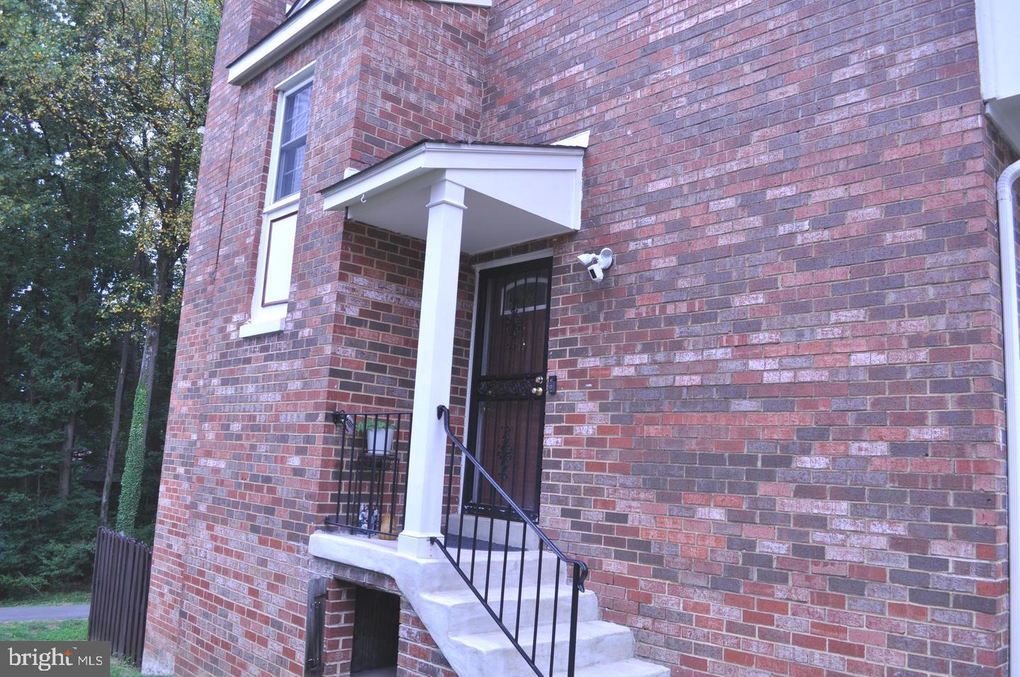 14613 Tynewick Terrace, Unit 61461 Silver Spring, MD 20906 - Photo 25 of 30 a building with a door and a door