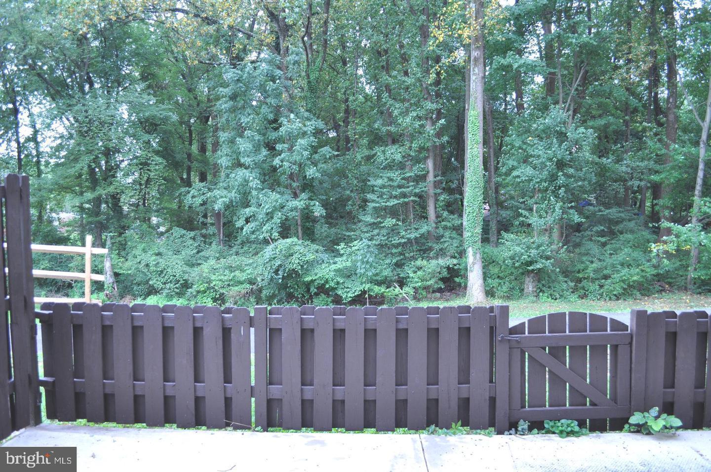 14613 Tynewick Terrace, Unit 61461 Silver Spring, MD 20906 - Photo 29 of 30 a view of a wooden fence