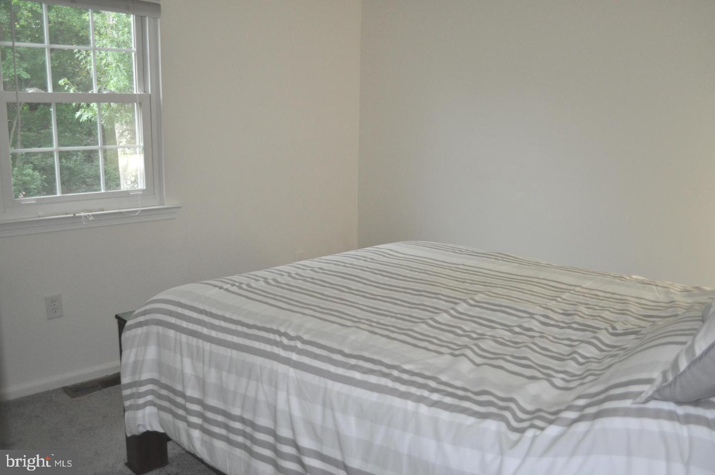 14613 Tynewick Terrace, Unit 61461 Silver Spring, MD 20906 - Photo 5 of 30 a close up of a bed