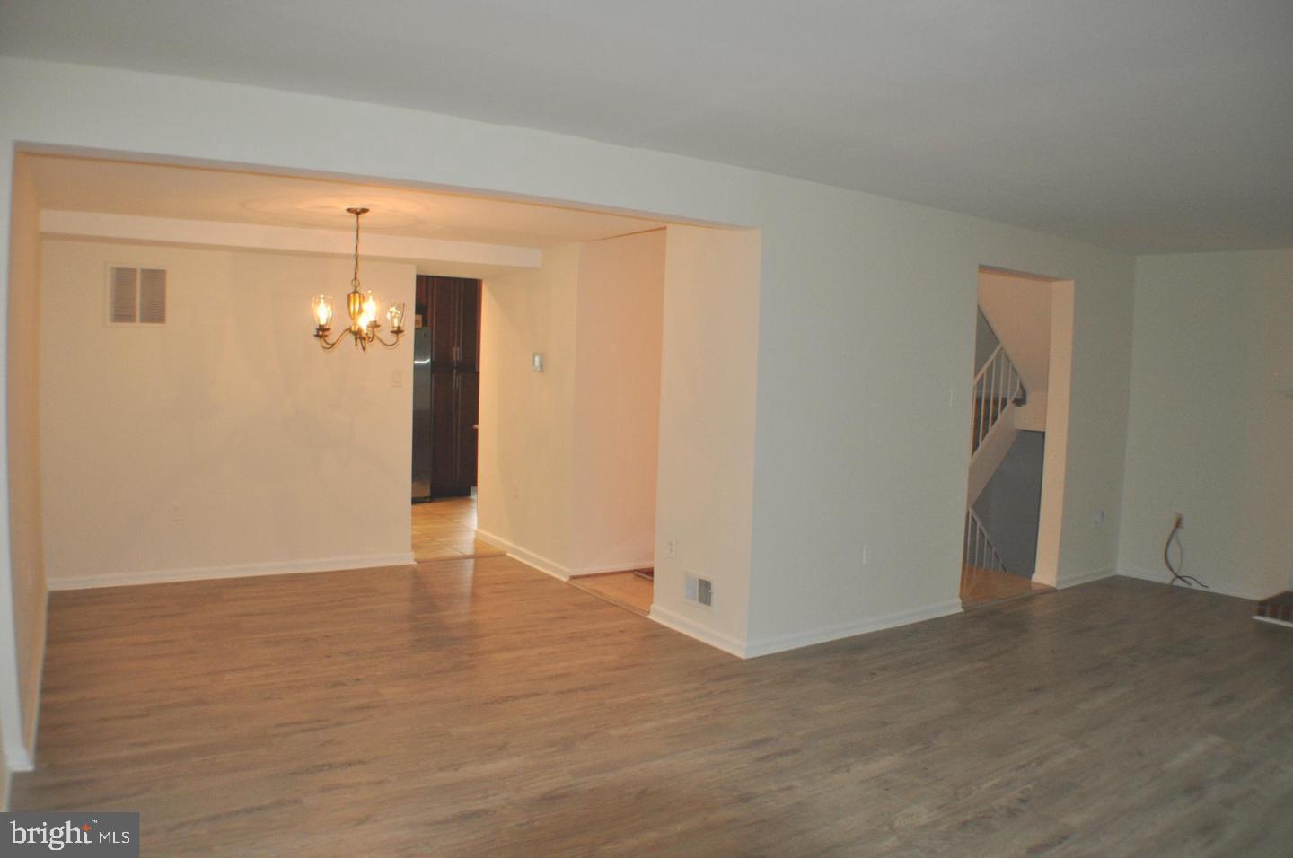 14613 Tynewick Terrace, Unit 61461 Silver Spring, MD 20906 - Photo 9 of 30 a view of a room with wooden floor