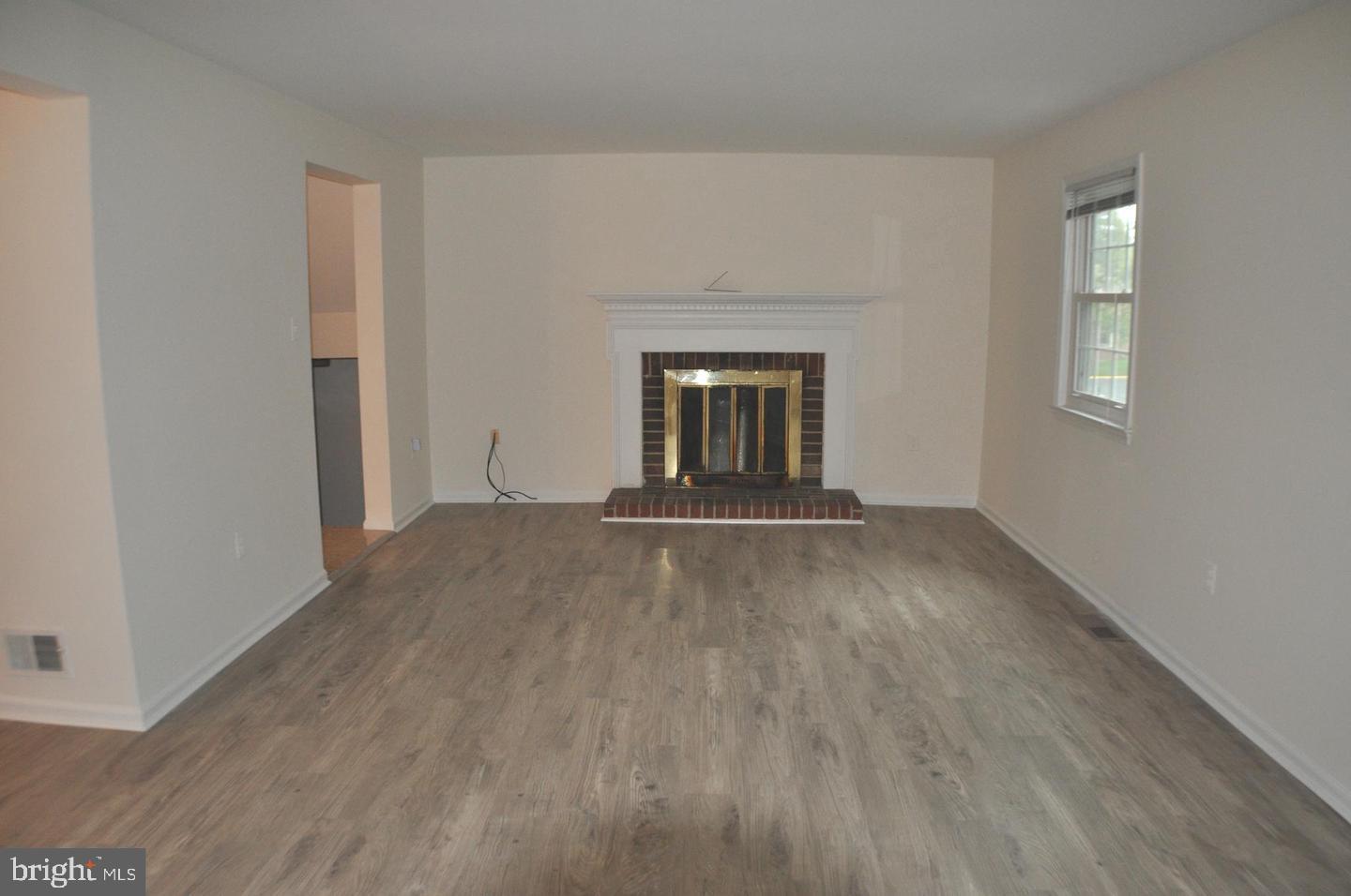14613 Tynewick Terrace, Unit 61461 Silver Spring, MD 20906 - Photo 10 of 30 a view of empty room with wooden floor and fan