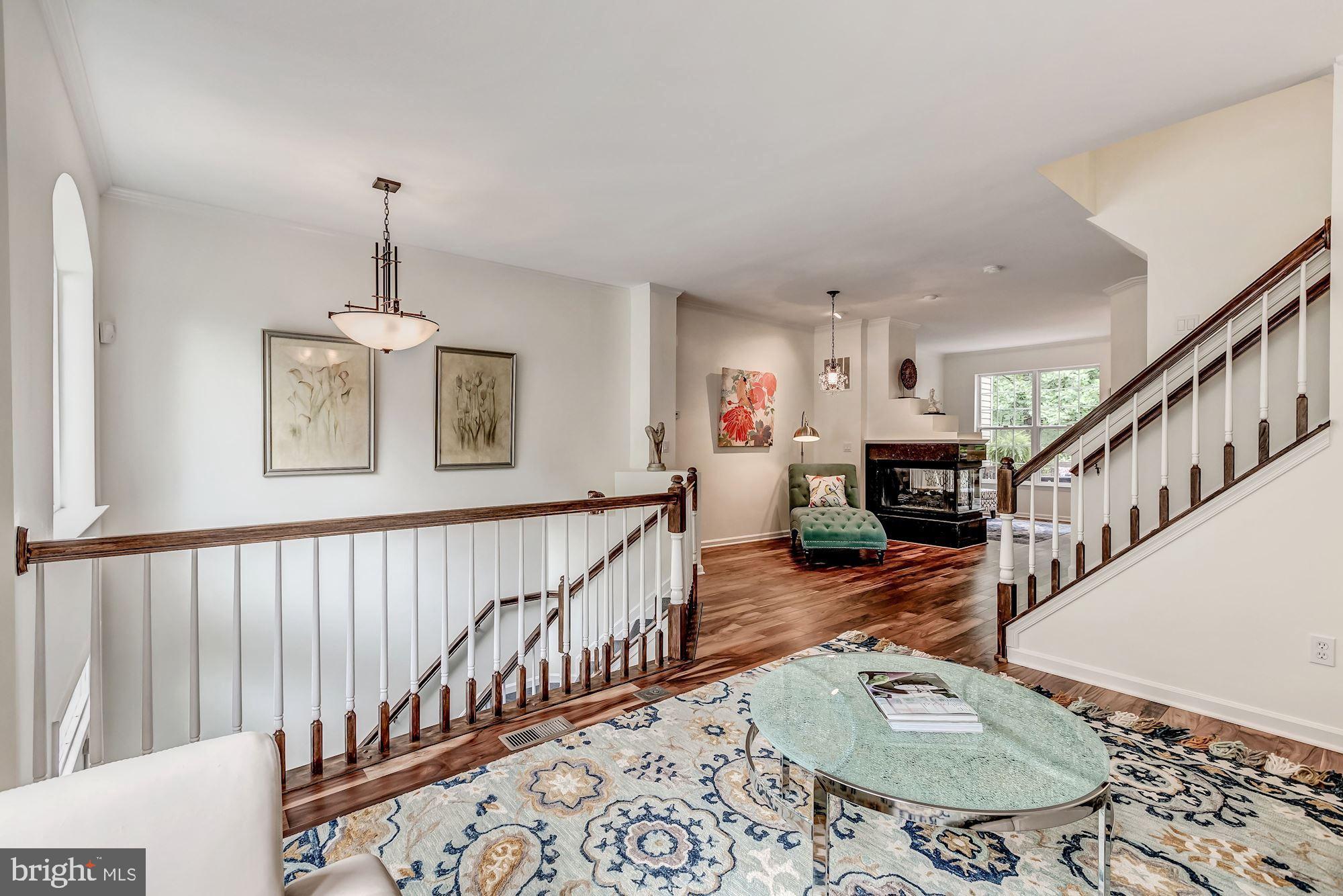 1205 Wild Hawthorn Way Reston, VA 20194 - Photo 11 of 53 Relax by the 3-way fireplace in a cozy nook