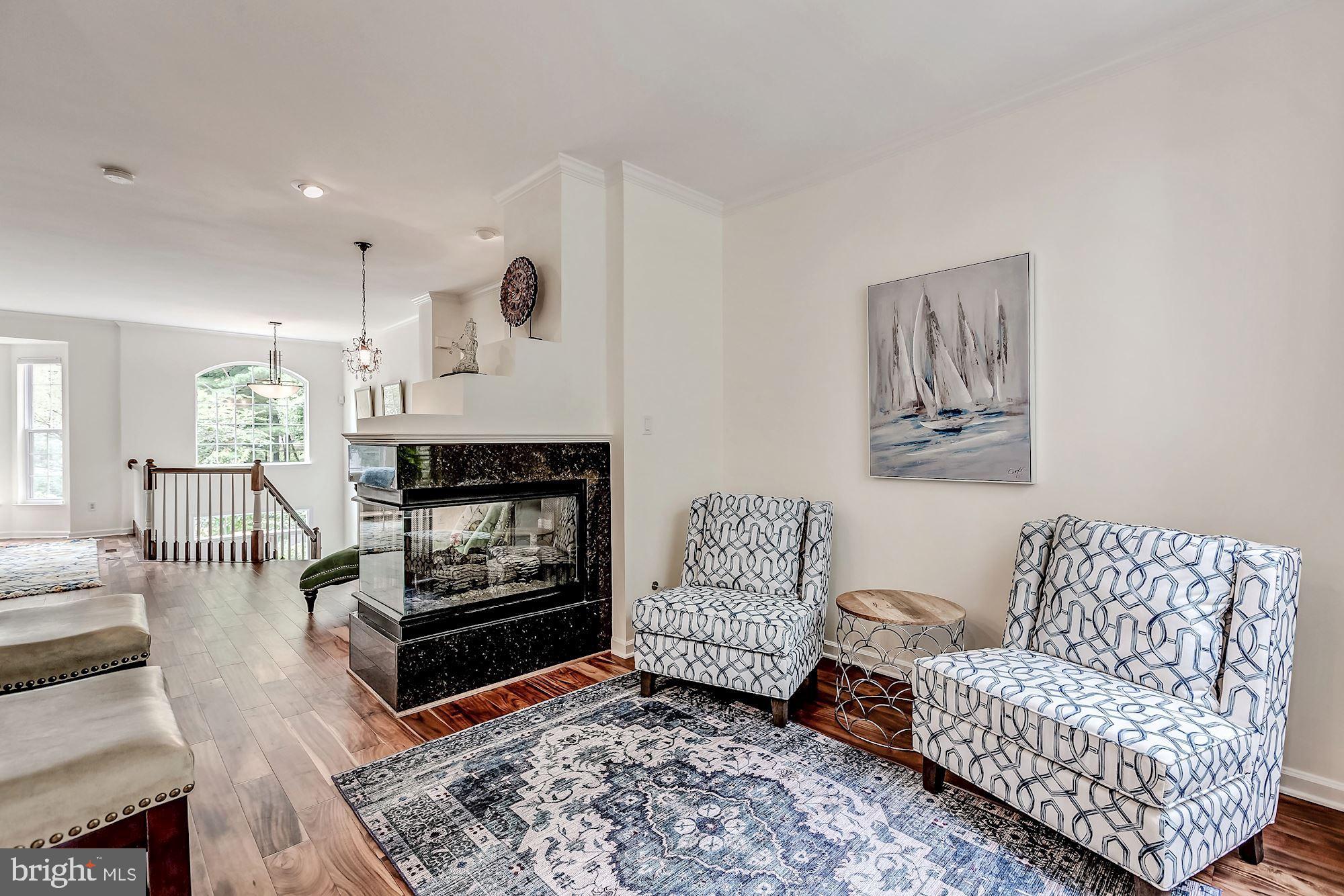 1205 Wild Hawthorn Way Reston, VA 20194 - Photo 15 of 53 3-way fireplace enhances gathering/Family room