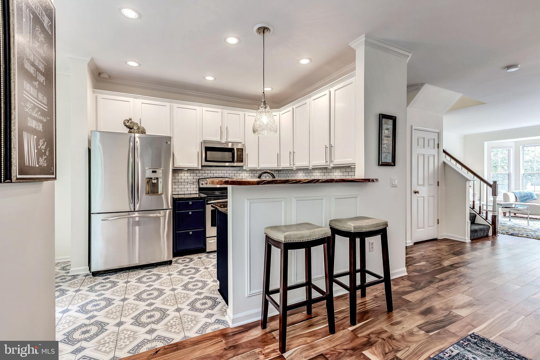 1205 Wild Hawthorn Way Reston, VA 20194 - Photo 17 of 53 Breakfast Bar has "Live Edge" custom wood counter