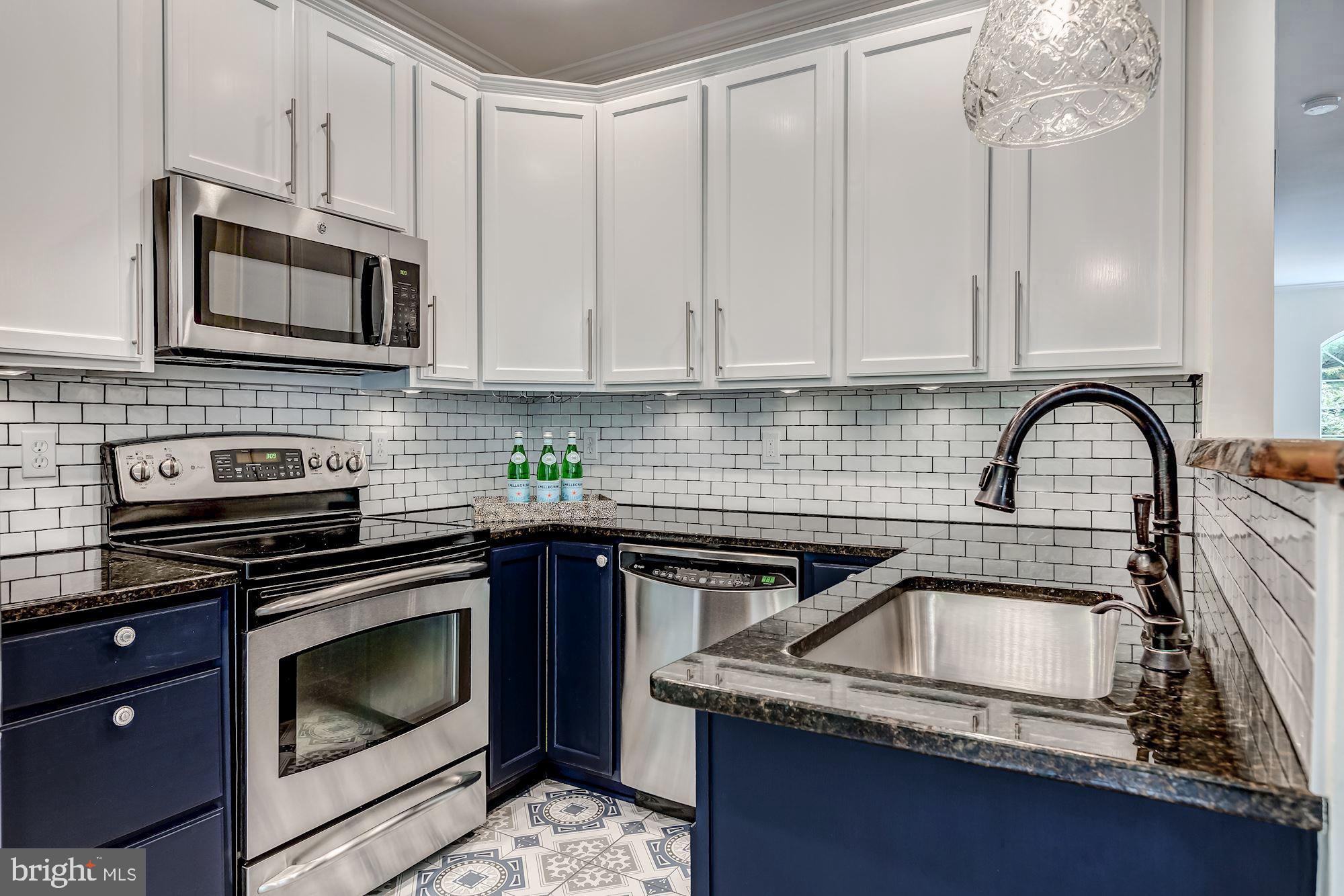1205 Wild Hawthorn Way Reston, VA 20194 - Photo 20 of 53 Subway Tile back splash & designer cabinet colors