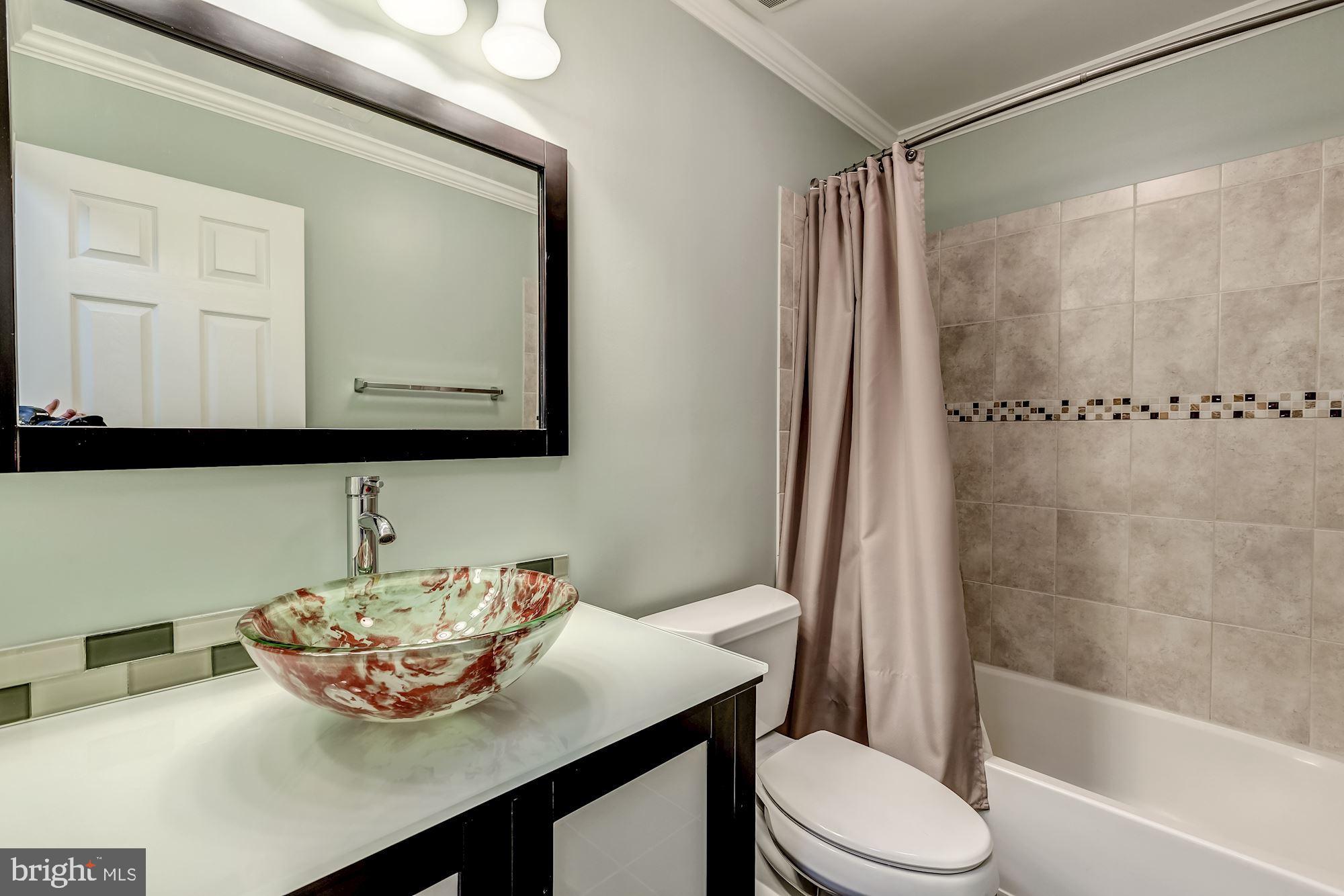 1205 Wild Hawthorn Way Reston, VA 20194 - Photo 39 of 53 Updated upper hall bath has beautiful tile