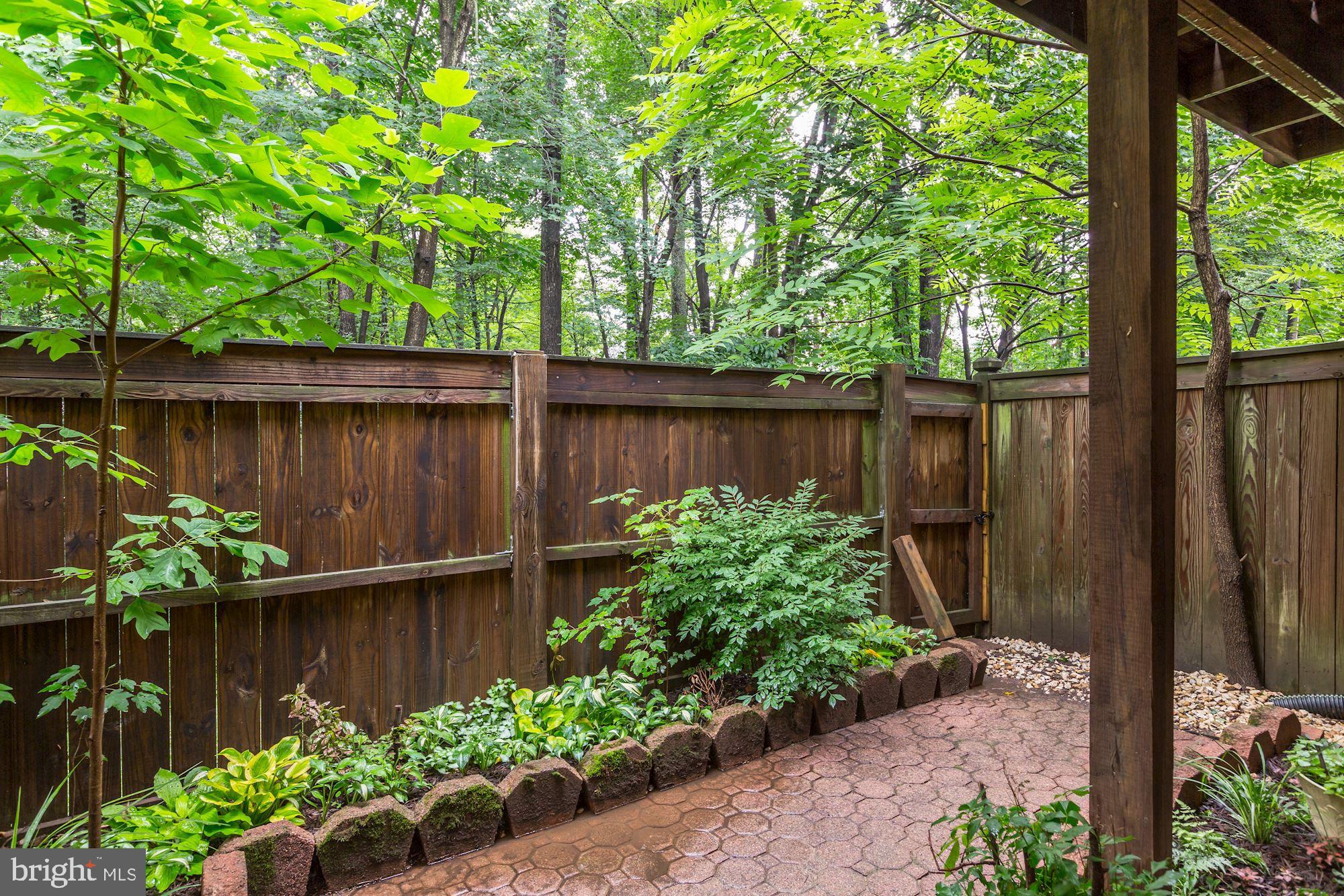 1205 Wild Hawthorn Way Reston, VA 20194 - Photo 49 of 53 Lovely gardens and paved walkway in fenced yard
