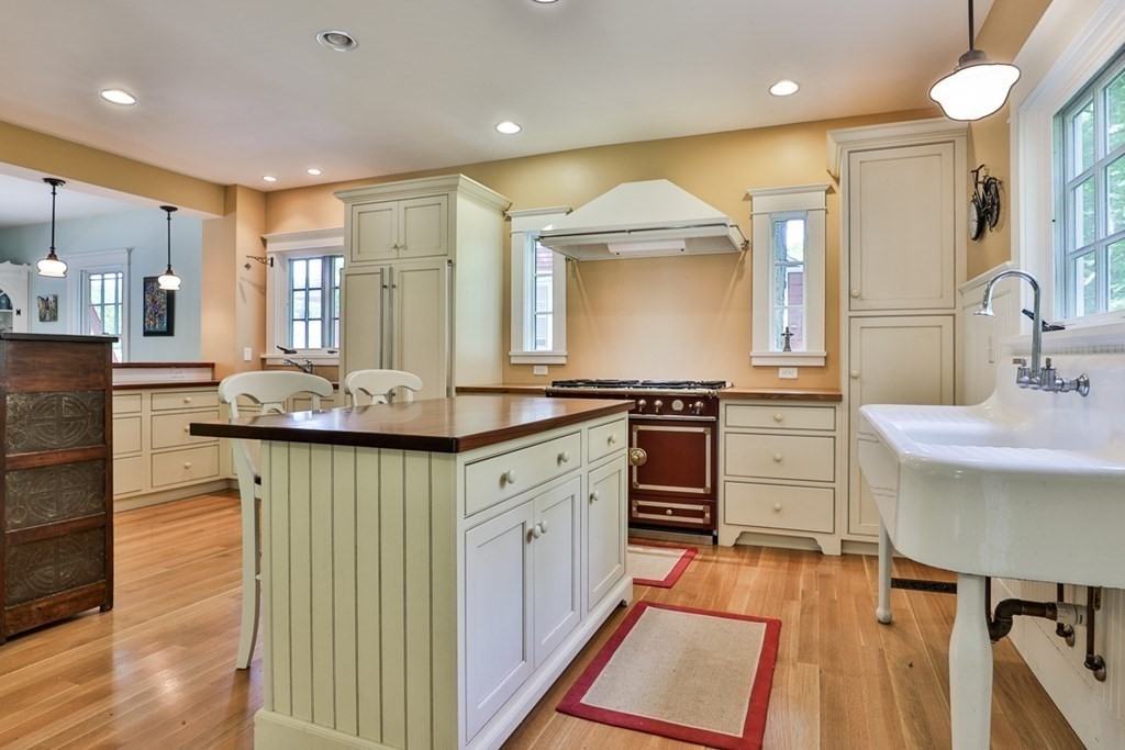 14 Still River Road Harvard, MA 01451 - Photo 15 of 39 a kitchen with granite countertop a sink stove and cabinets