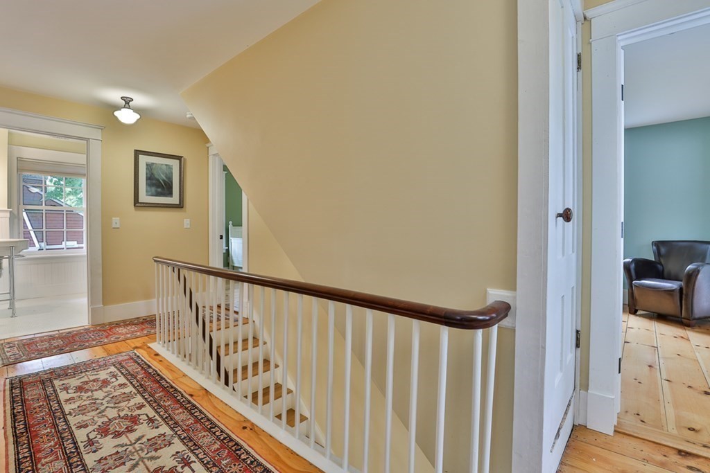 14 Still River Road Harvard, MA 01451 - Photo 22 of 39 a view of a hallway and a livingroom with wooden floor