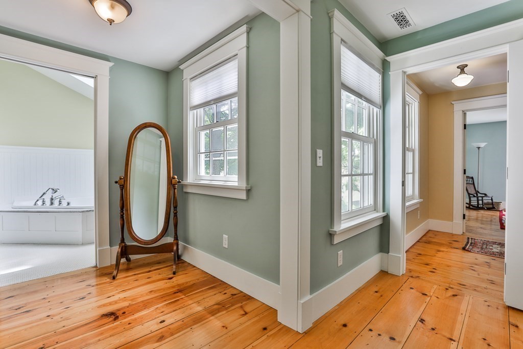 14 Still River Road Harvard, MA 01451 - Photo 31 of 39 a view of an entryway with wooden floor and mirror