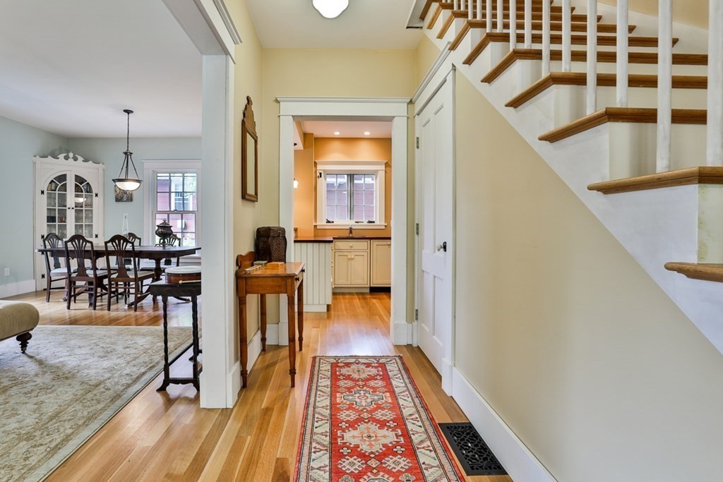 14 Still River Road Harvard, MA 01451 - Photo 5 of 39 a view of a hallway with wooden floor and dining room