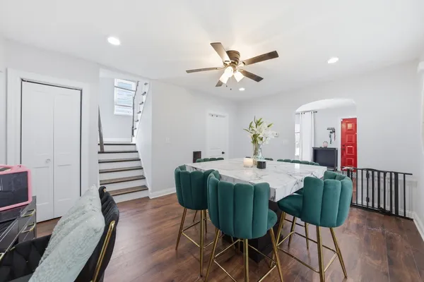 a view of a dining room with furniture and wooden floor