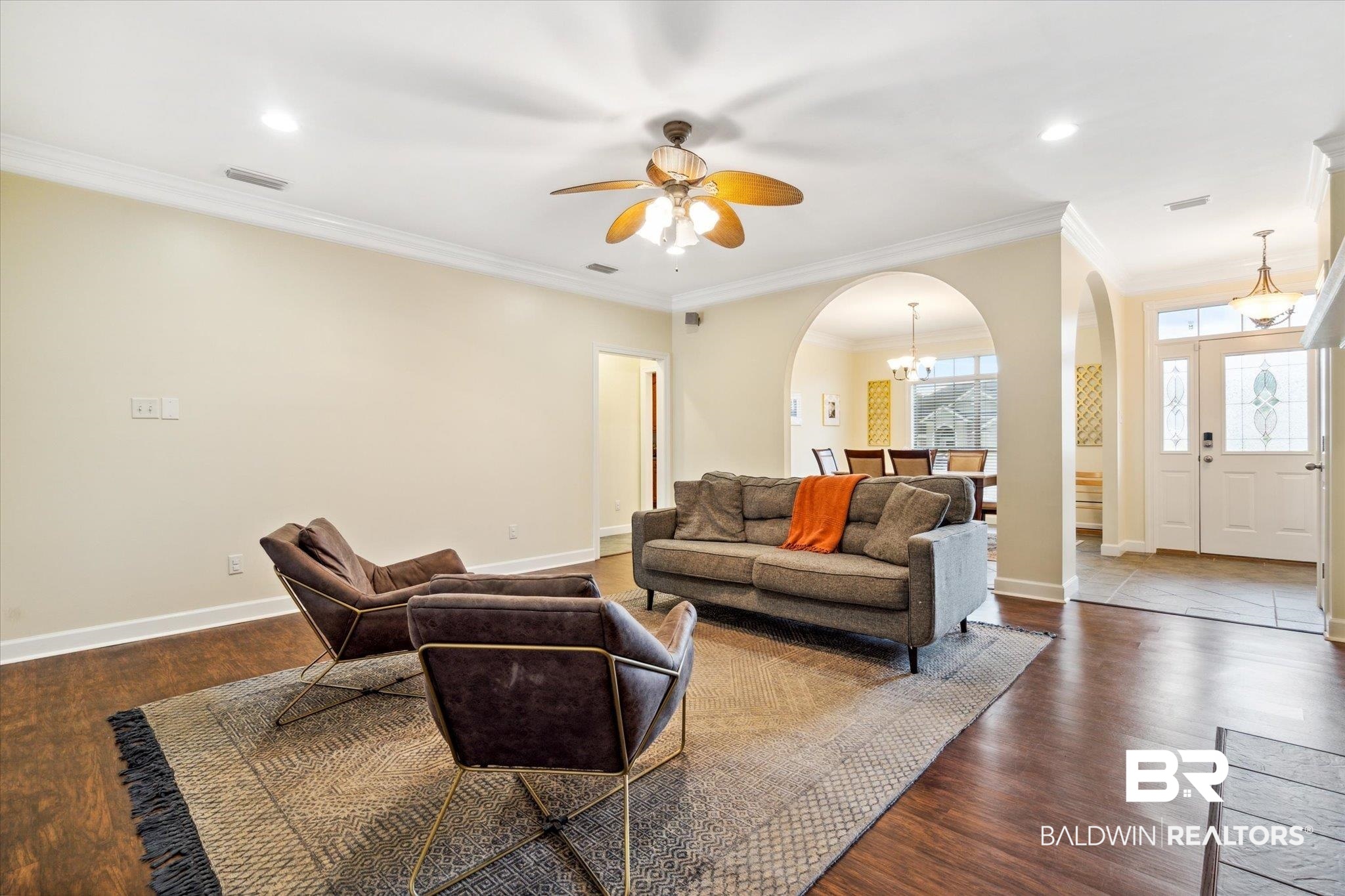 1561 William Dunn Way Mobile, AL 36695 - Photo 5 of 28 Living room with ceiling fan with notable chandelier, crown molding, and hardwood / wood-style floors