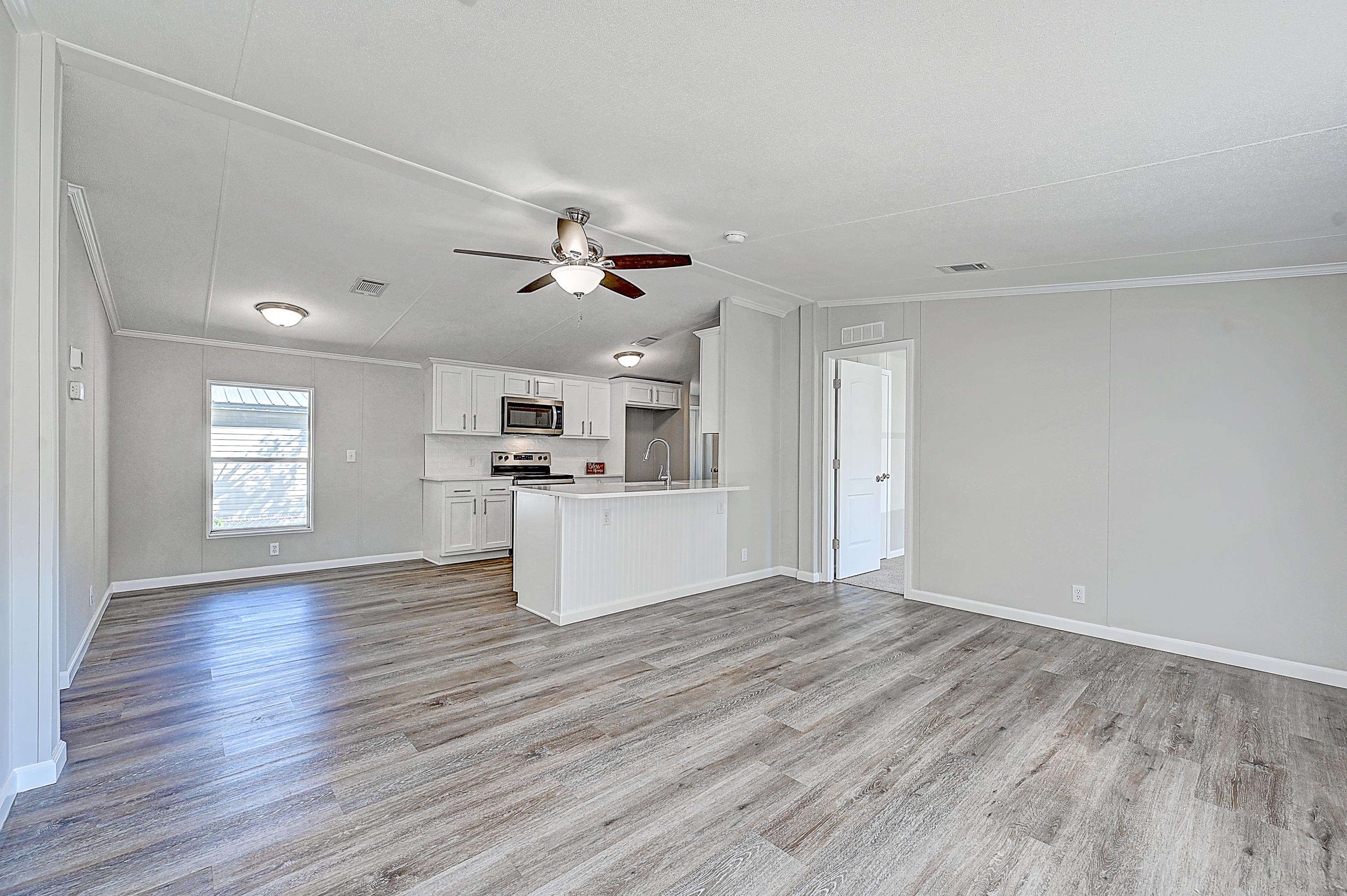 800 Oakes Avenue St. Augustine, FL 32084 - Photo 16 of 26 a view of kitchen with microwave and wooden floor