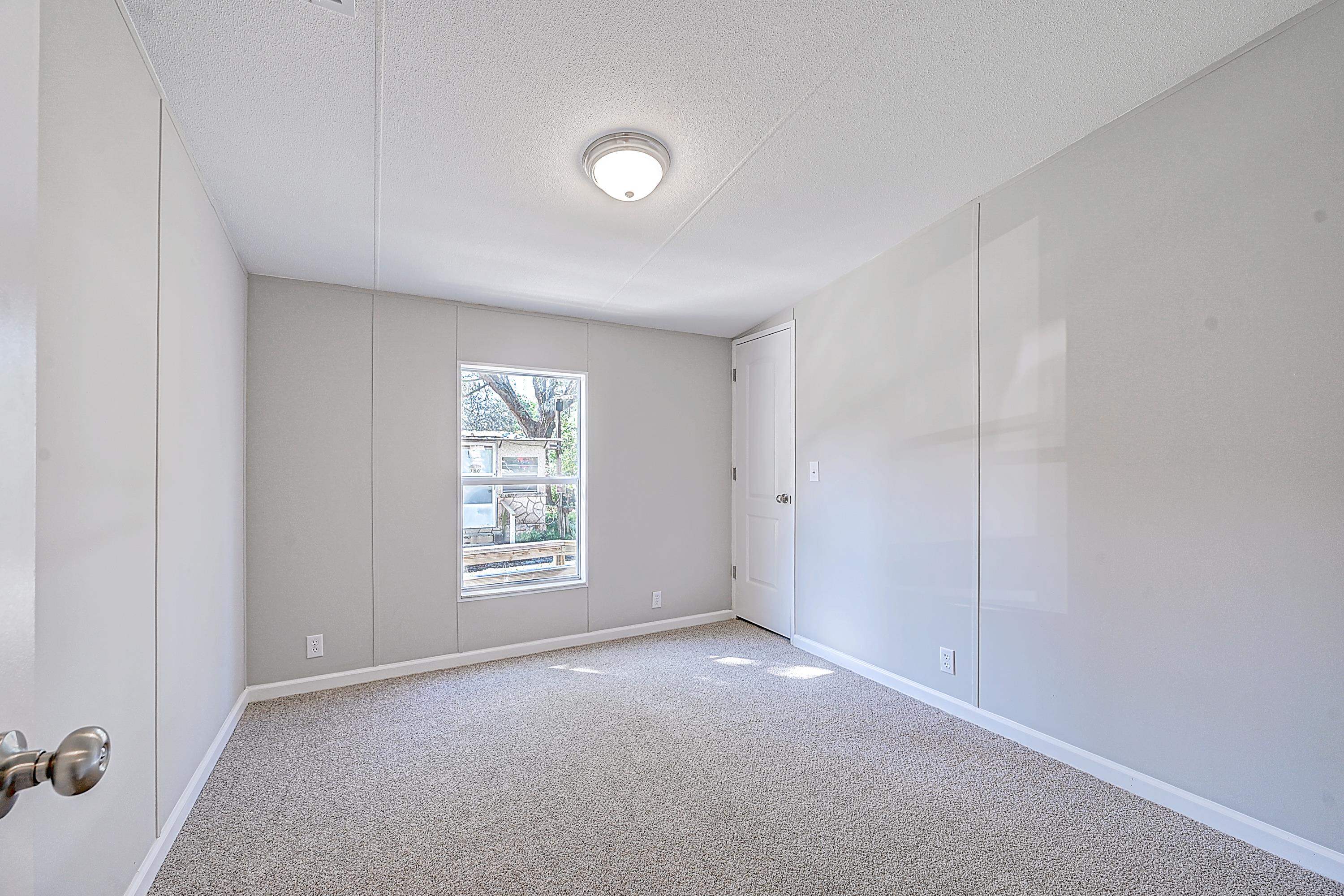 800 Oakes Avenue St. Augustine, FL 32084 - Photo 2 of 26 a view of an empty room with windows