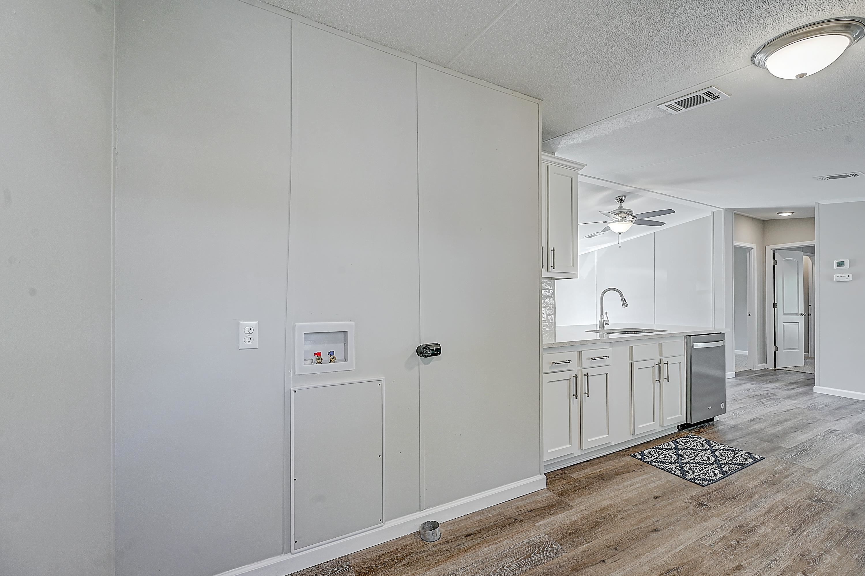 800 Oakes Avenue St. Augustine, FL 32084 - Photo 3 of 26 a spacious bathroom with a granite countertop sink and a mirror