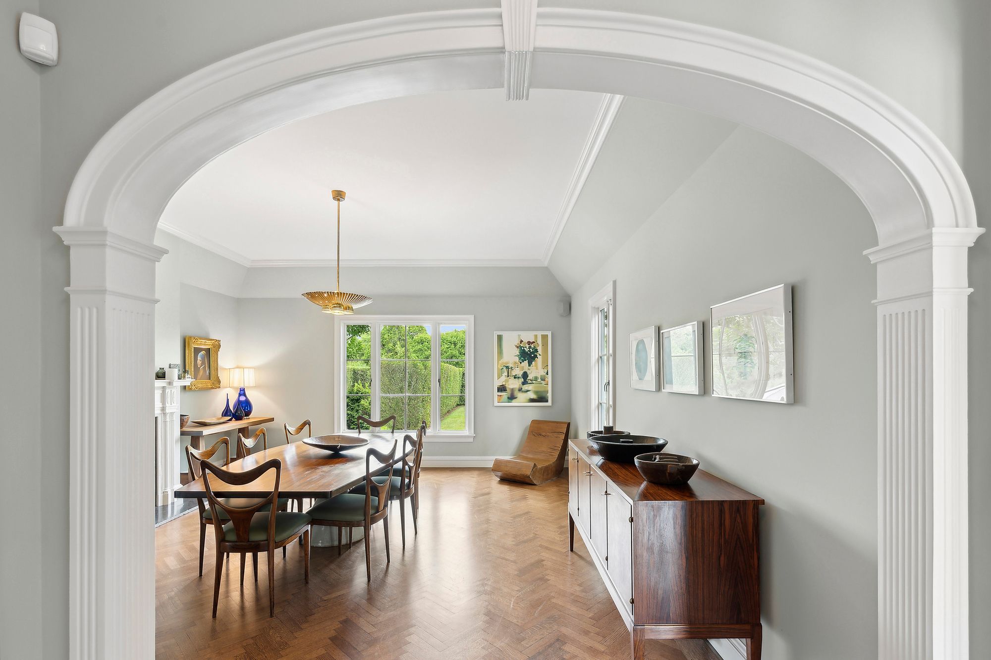 153 Egypt Lane East Hampton, NY 11937 - Photo 12 of 47 a living room with furniture and a chandelier
