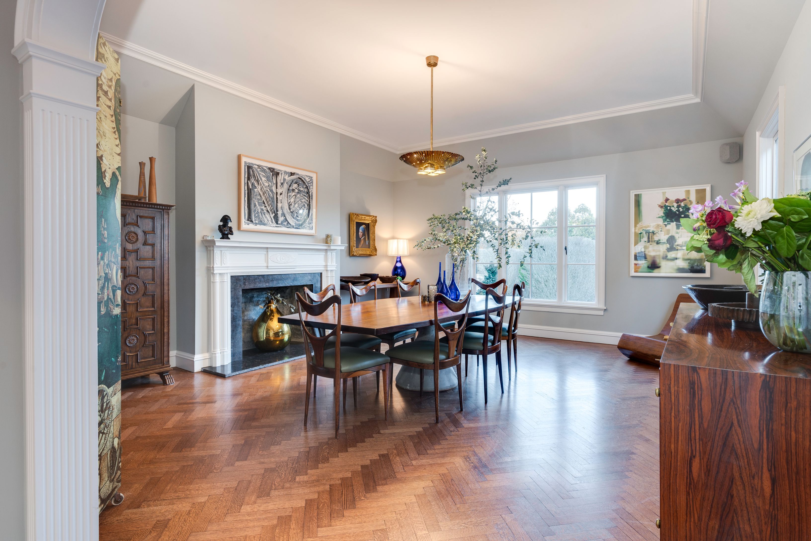 153 Egypt Lane East Hampton, NY 11937 - Photo 14 of 47 a view of a dining room with furniture window and wooden floor