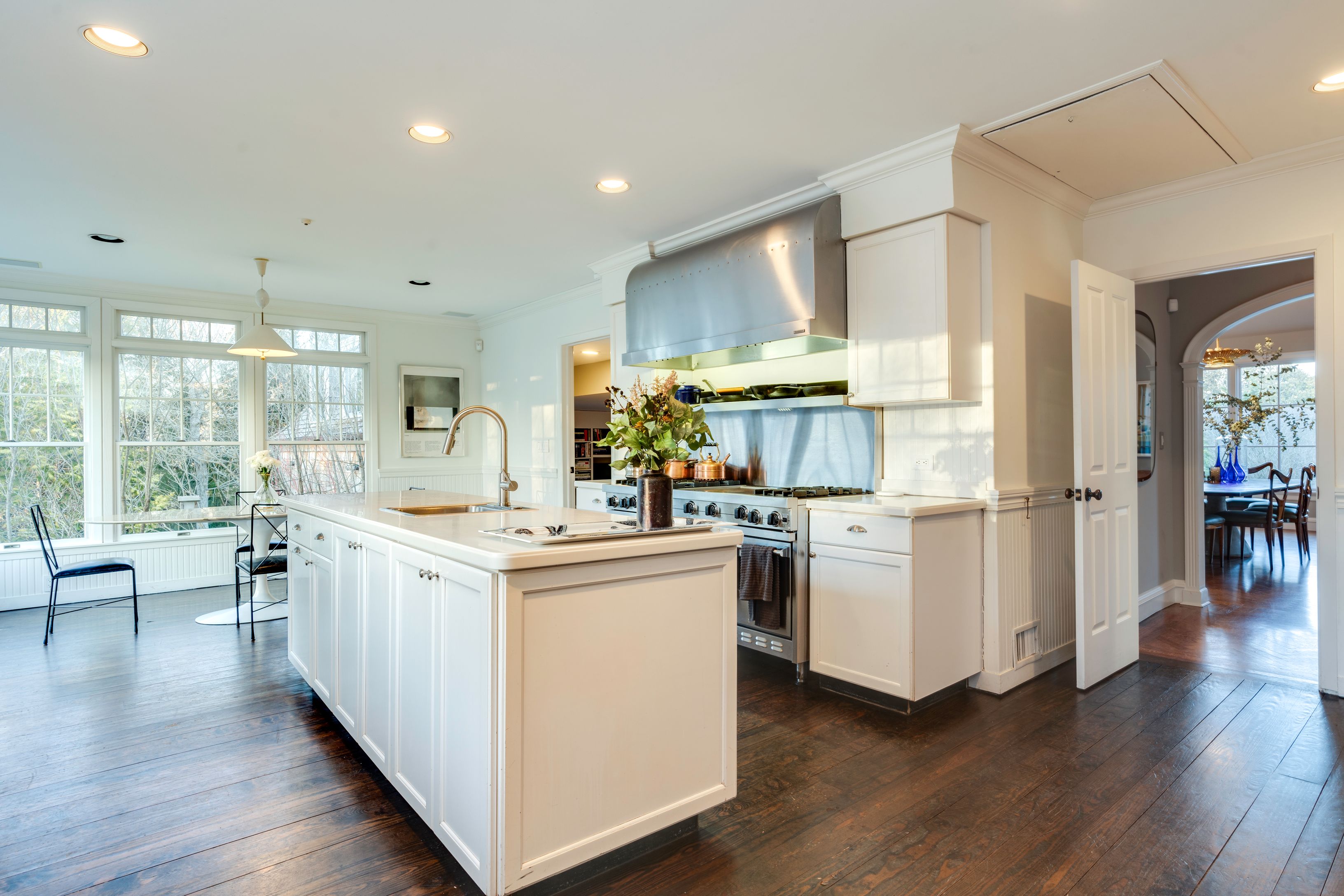 153 Egypt Lane East Hampton, NY 11937 - Photo 17 of 47 a kitchen with stove and wooden floor