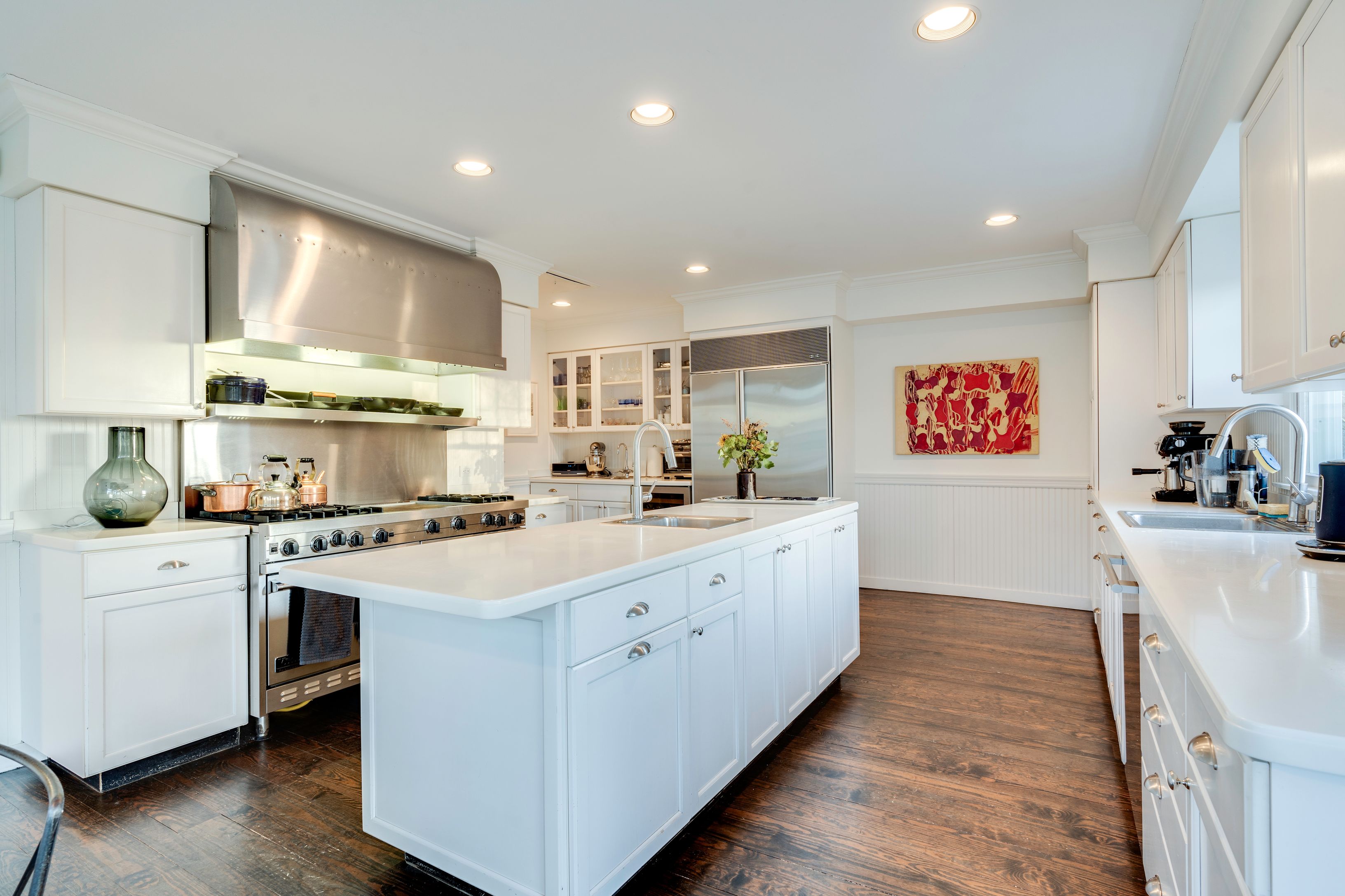 153 Egypt Lane East Hampton, NY 11937 - Photo 18 of 47 a kitchen with a stove a sink and a refrigerator