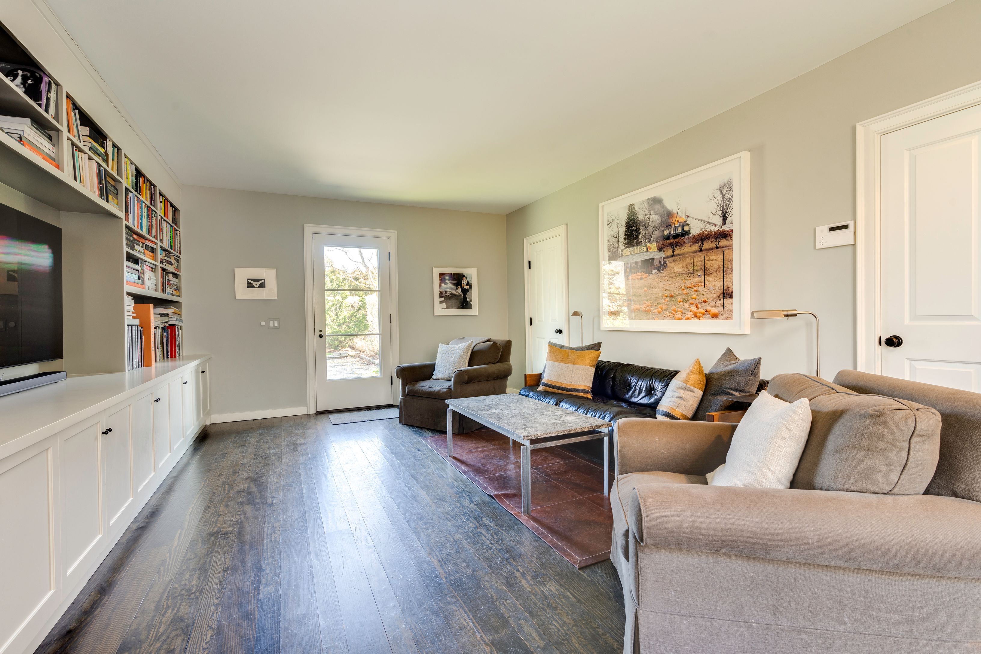 153 Egypt Lane East Hampton, NY 11937 - Photo 20 of 47 a living room with furniture and a flat screen tv