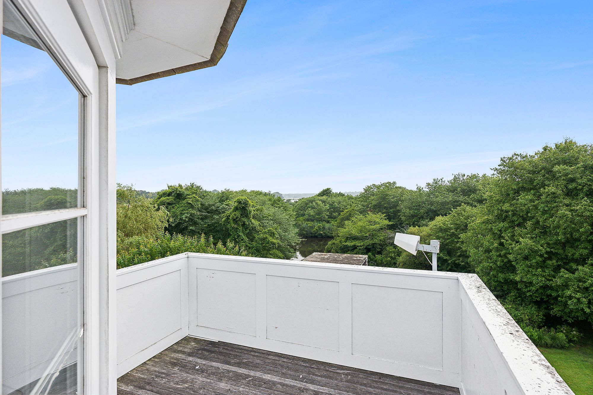 153 Egypt Lane East Hampton, NY 11937 - Photo 26 of 47 a view of a balcony with an outdoor space