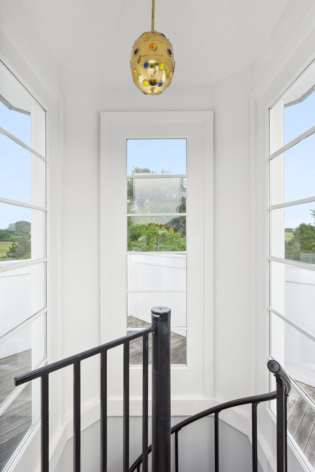 153 Egypt Lane East Hampton, NY 11937 - Photo 27 of 47 a view of a hallway with wooden floor and a window