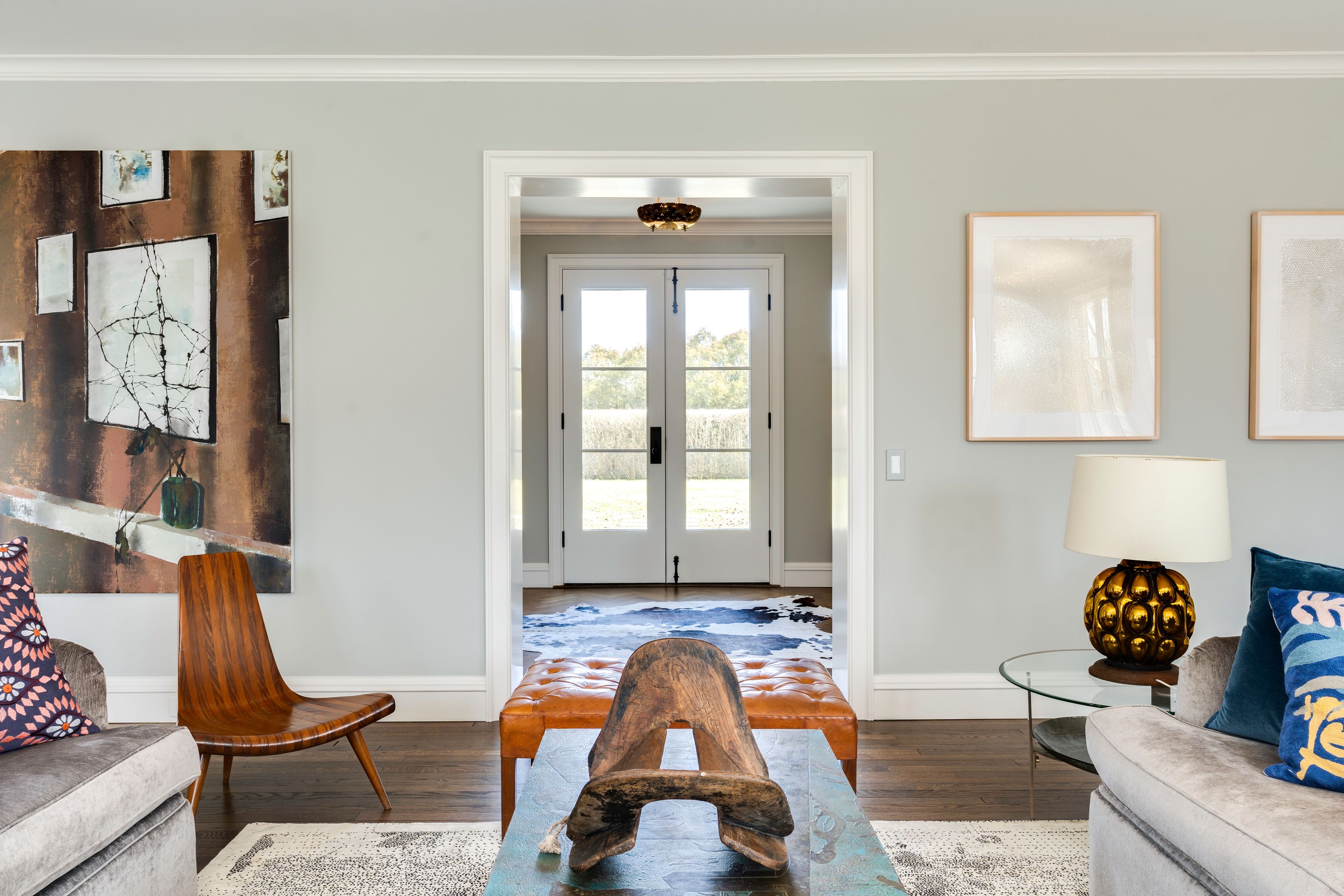 153 Egypt Lane East Hampton, NY 11937 - Photo 10 of 47 a living room with furniture and floor to ceiling windows