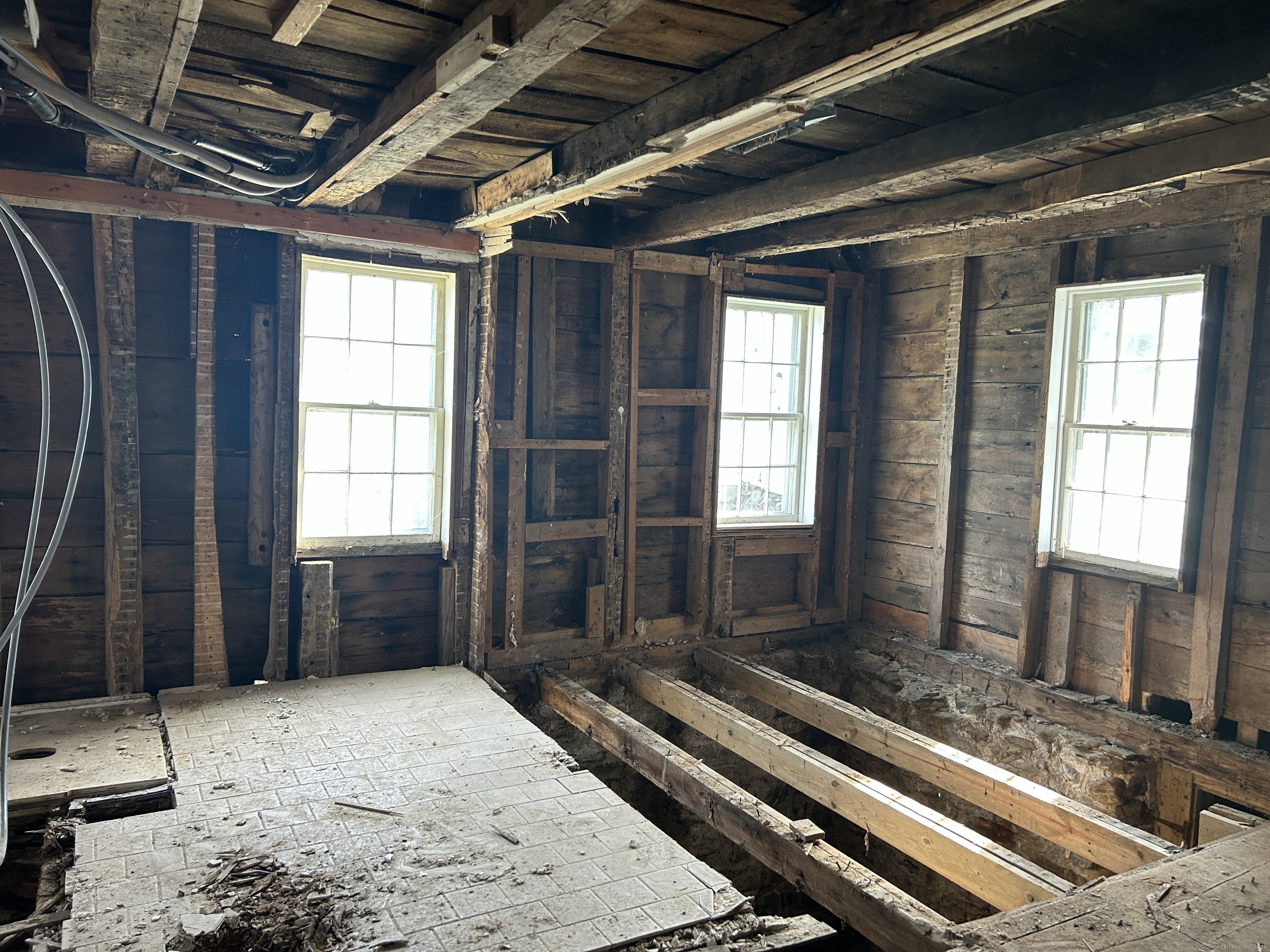 297 Main Street Hampton, CT 06247 - Photo 11 of 16 a living room with a couch next to a window
