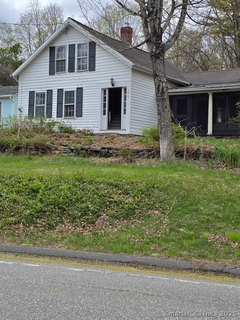 297 Main Street Hampton, CT 06247 - Photo 3 of 16 a front view of a house with a yard