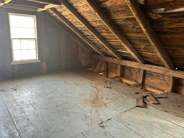 a view of an empty room with windows