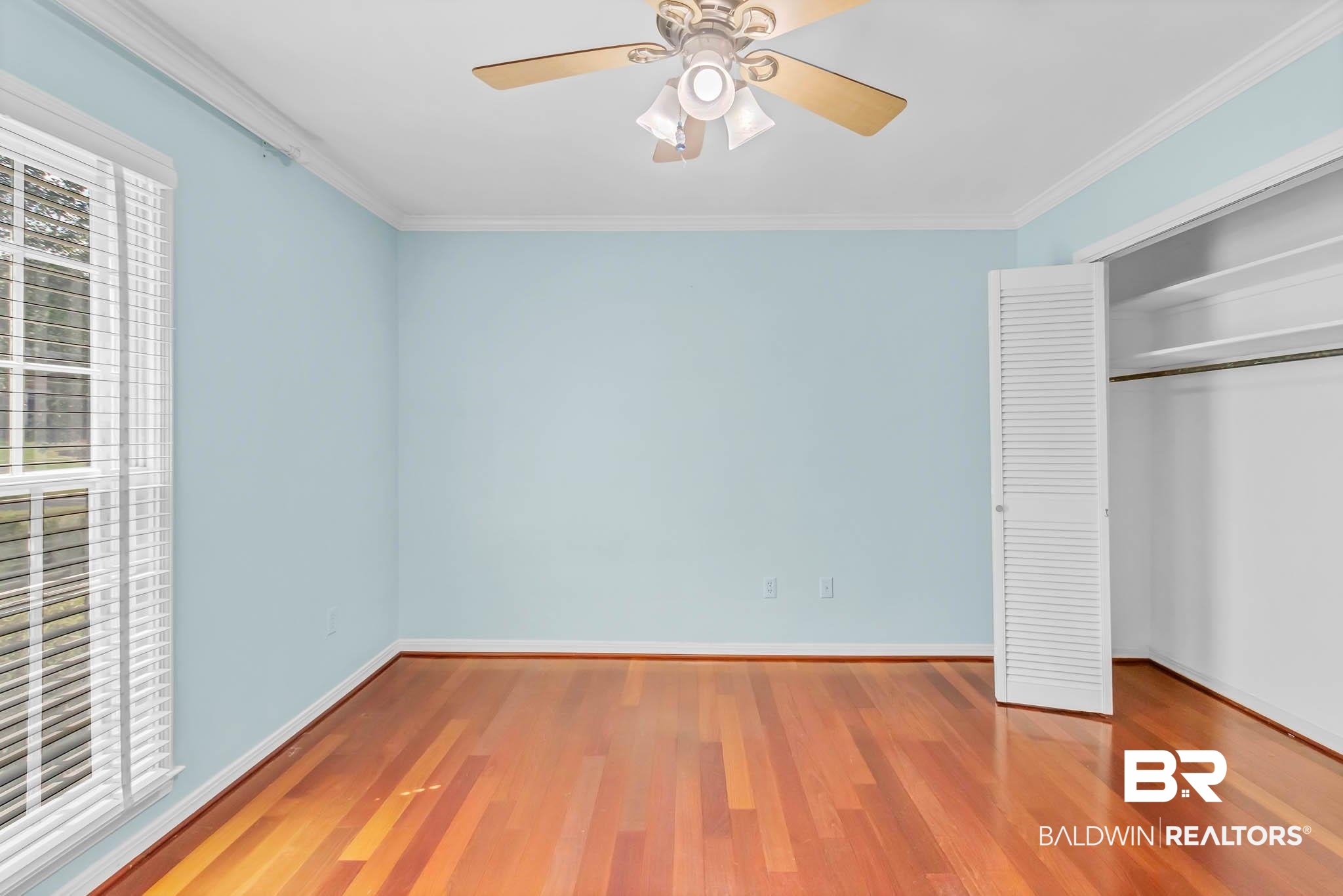 309 West Brandy Run Road Mobile, AL 36608 - Photo 51 of 100 Unfurnished bedroom with wood finished floors, ornamental molding, a closet, and a ceiling fan