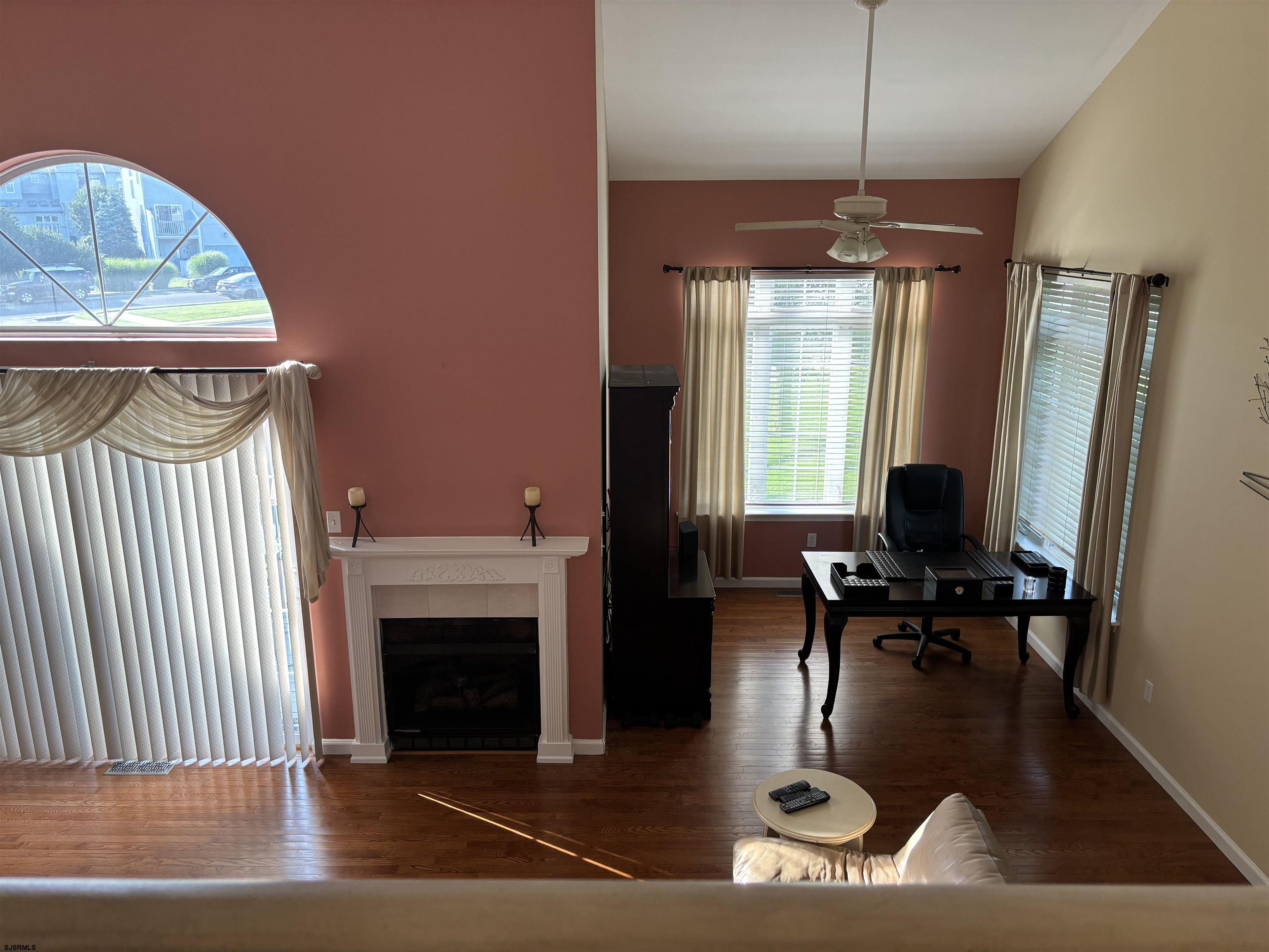 66 Sailfish Drive Brigantine, NJ 08203 - Photo 12 of 24 a living room with furniture and a fireplace