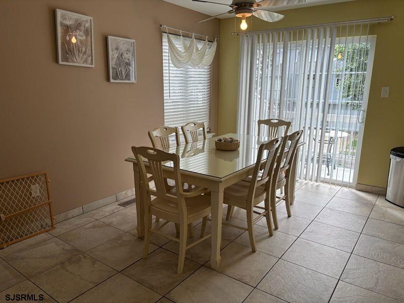 66 Sailfish Drive Brigantine, NJ 08203 - Photo 15 of 24 a dining room with furniture and window