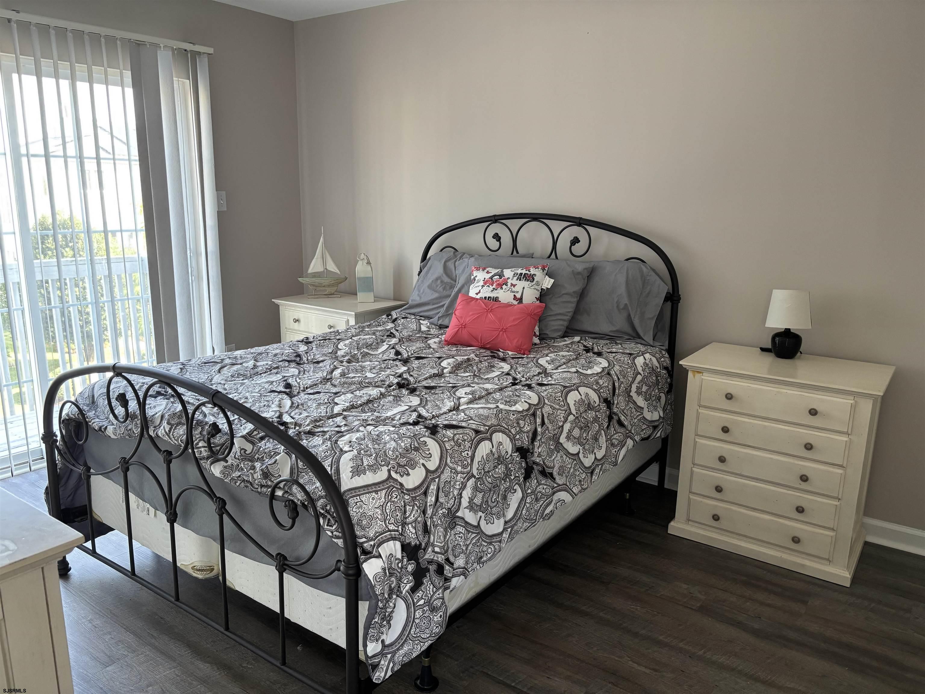 66 Sailfish Drive Brigantine, NJ 08203 - Photo 18 of 24 a bedroom with a bed and a window