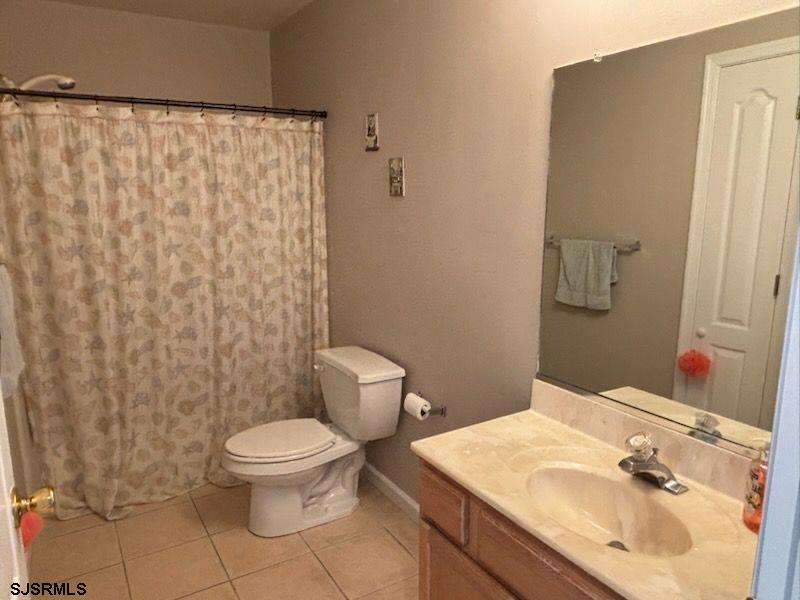 66 Sailfish Drive Brigantine, NJ 08203 - Photo 19 of 24 a bathroom with a sink toilet and shower